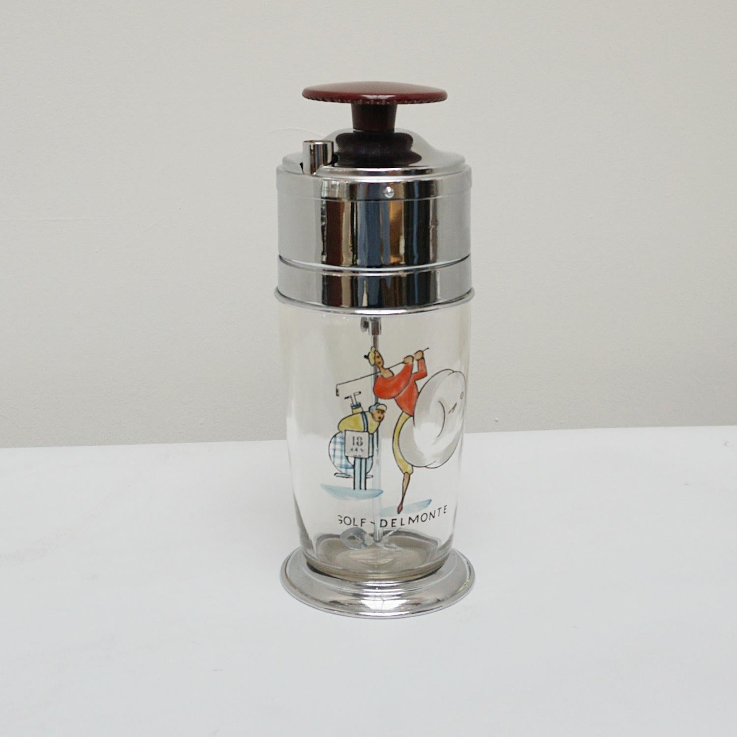 A vintage self mixing cocktail shaker. 'Golf Delmonte' with a cartoon image of a golfer hitting of the 18th tee. Silver plated to bottom and top section with bakelite winding wheel. 

Origin: American

Date: Circa 1950

Item Number: 3003224.