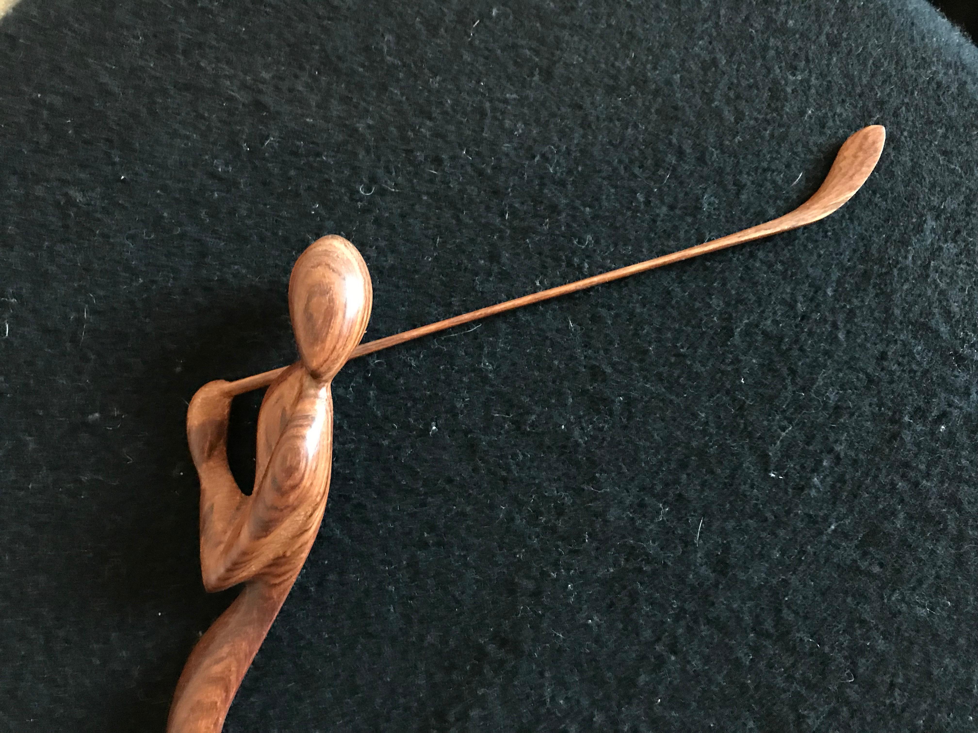 Wood sculpture representing a Golfer, beautiful movement and wood.
Unknown signed artist.
 