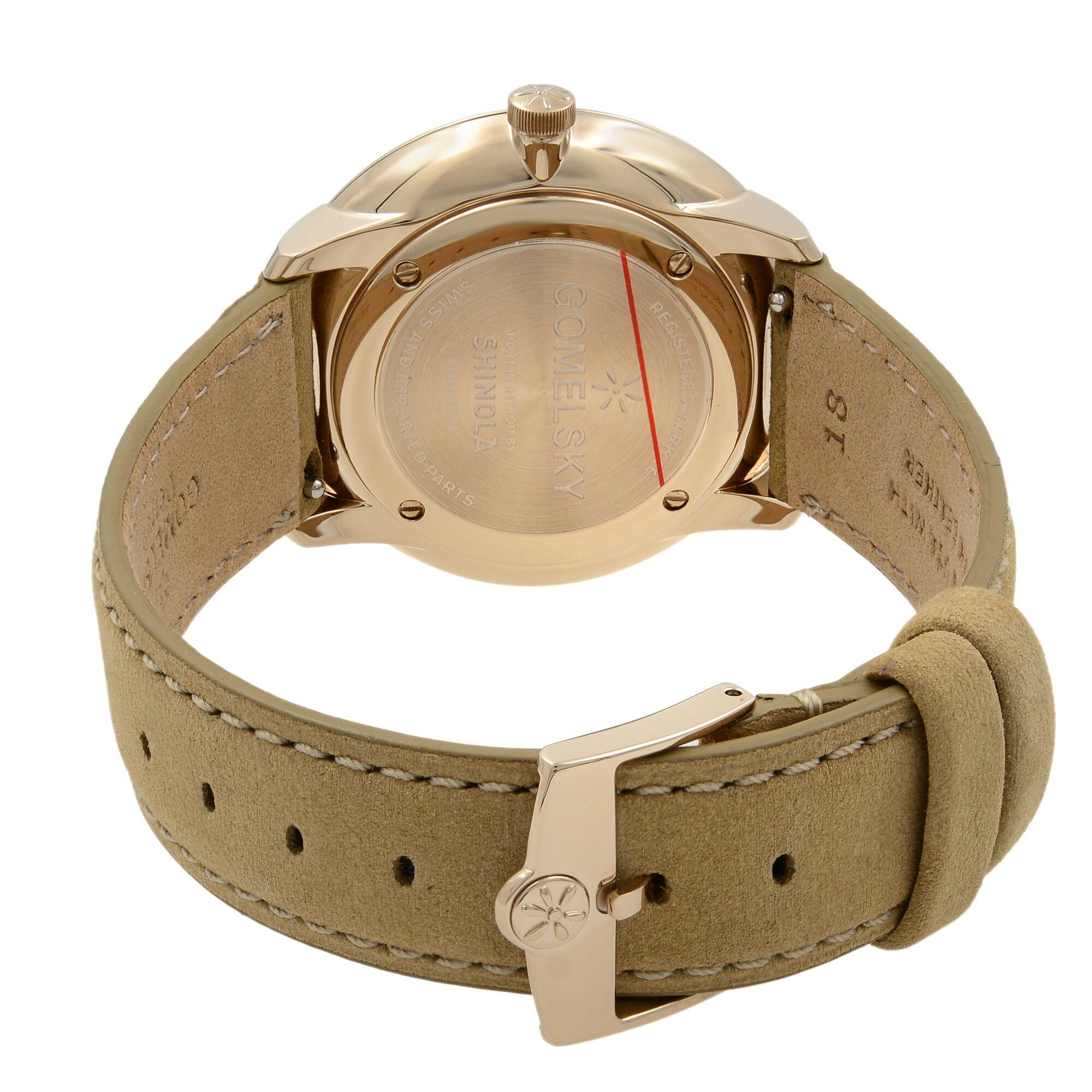 gold watch green face