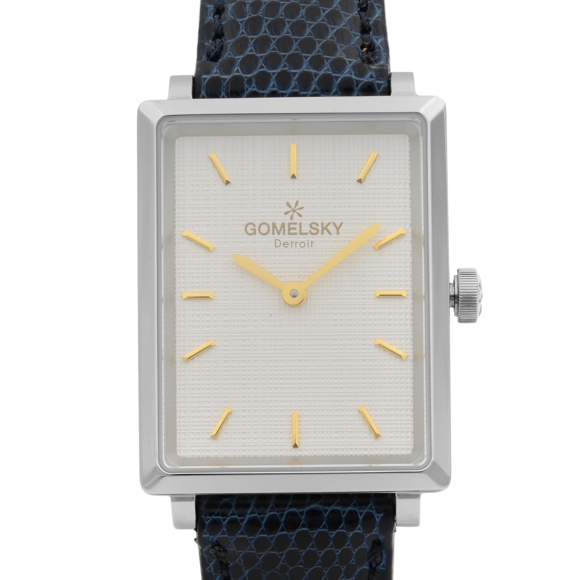 This brand new Gomelsky Shirley Fromer G0120072636 is a beautiful Ladie's timepiece that is powered by quartz (battery) movement which is cased in a stainless steel case. It has a  rectangle shape face,  dial, and has hand sticks style markers. It