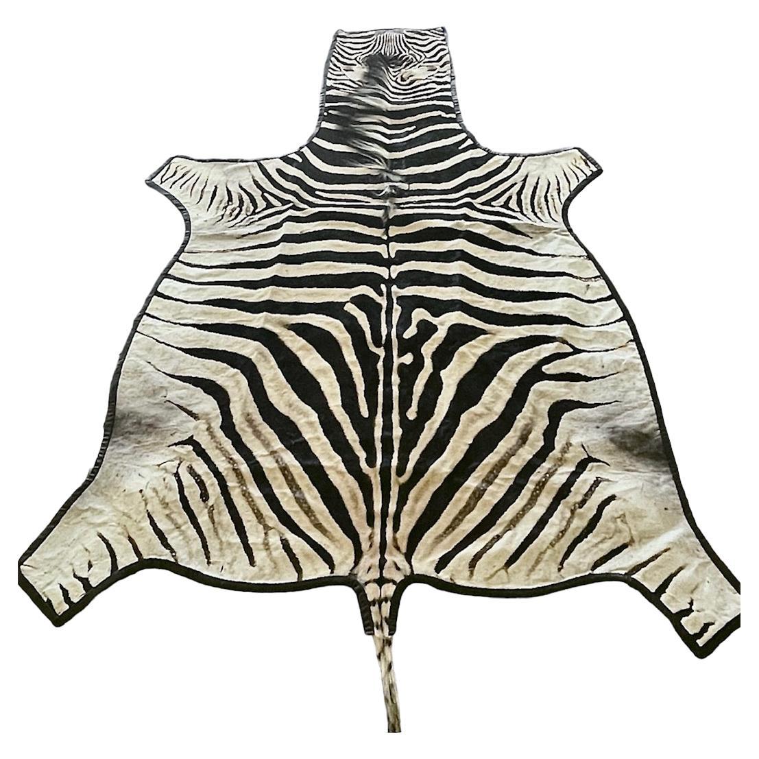 Gomez Zebra Hide Rug Trimmed in Black Italian Leather For Sale