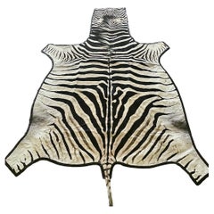 Gomez Zebra Hide Rug Trimmed in Black Italian Leather