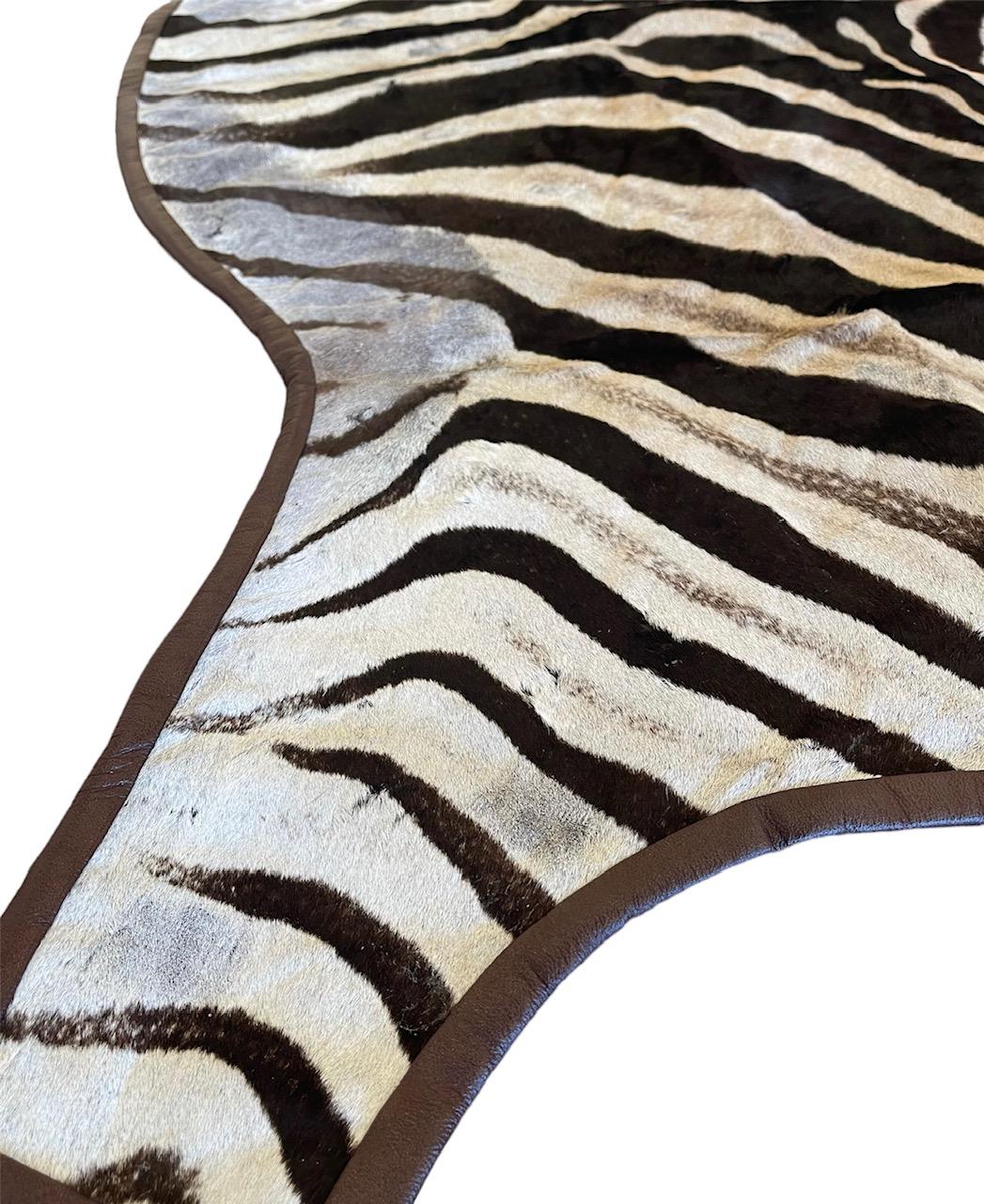 Gomez Zebra Hide Rug Trimmed in Brown Italian Leather For Sale 1