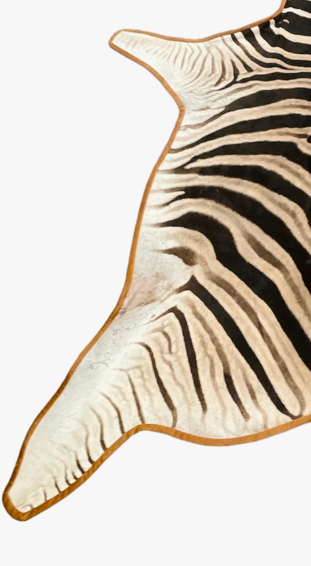 Modern Gomez Zebra Hide Rug Trimmed in Light Brown Italian Leather For Sale