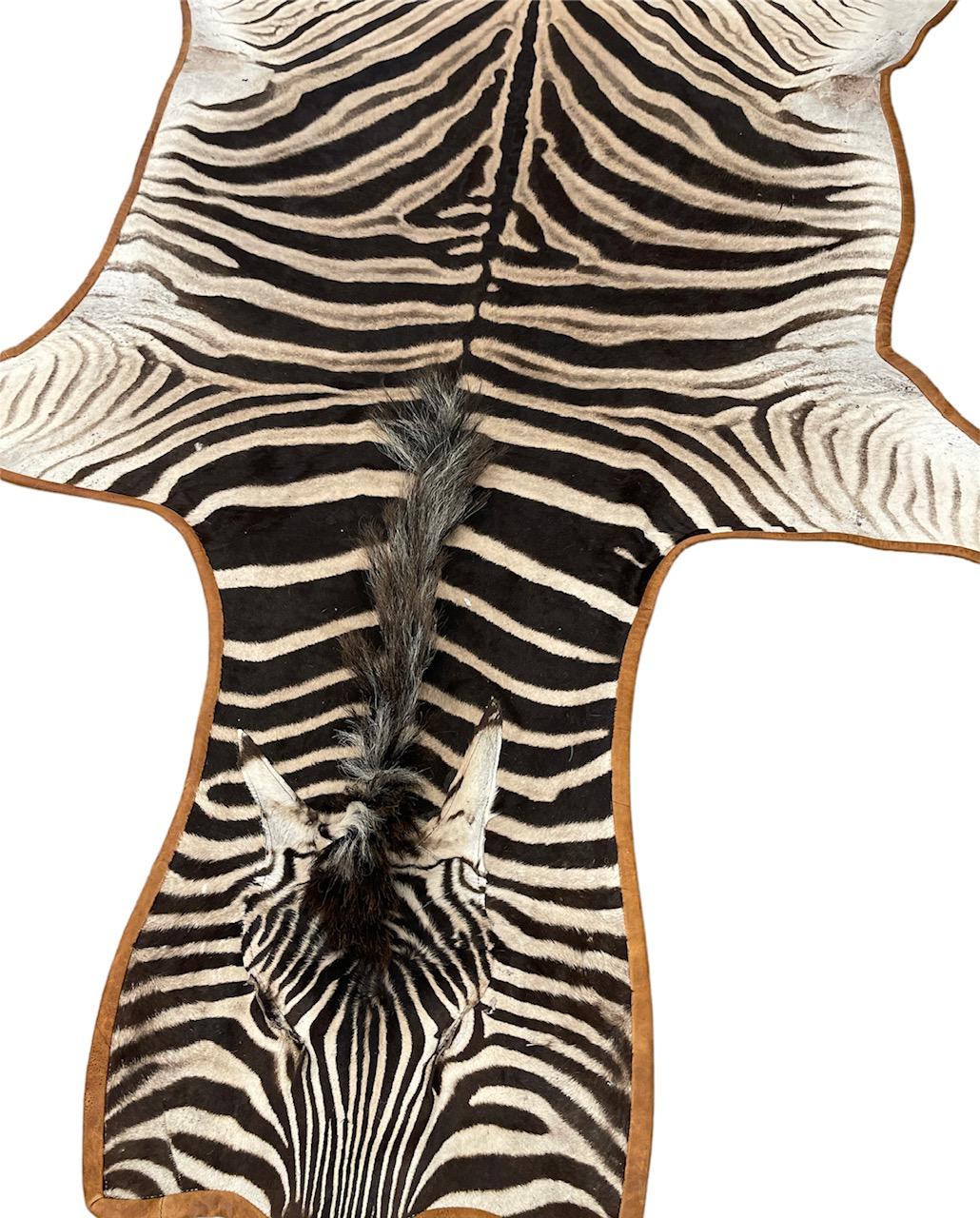 Gomez Zebra Hide Rug Trimmed in Light Brown Italian Leather In New Condition For Sale In Saint Louis, US