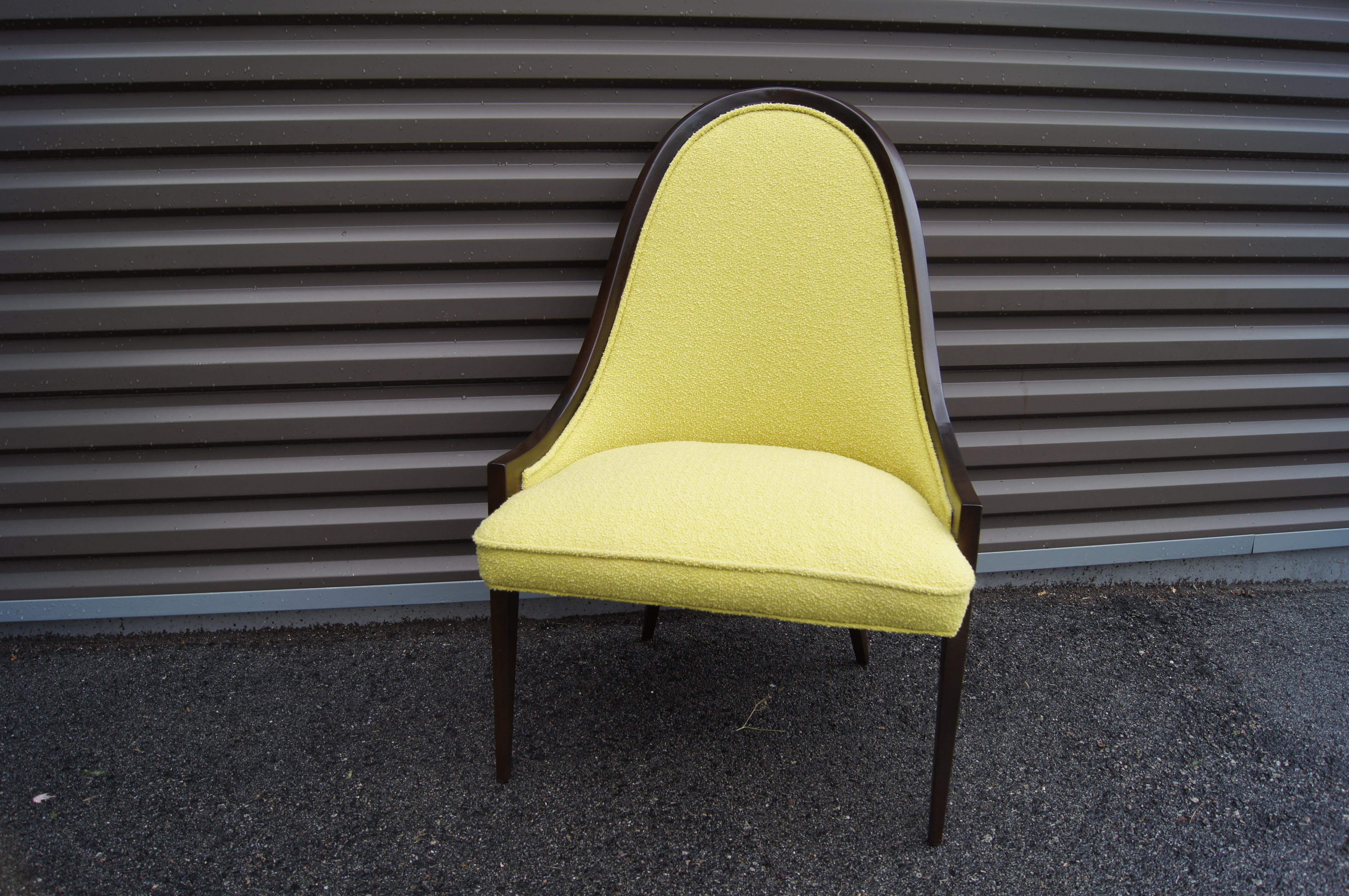 Harvey Probber designed his gondola chair, model no. 1053, with an elegantly curved high-back frame in deep mahogany. The chair has been newly upholstered in Knoll's Classic Bouclé in an eye-catching chartreuse.