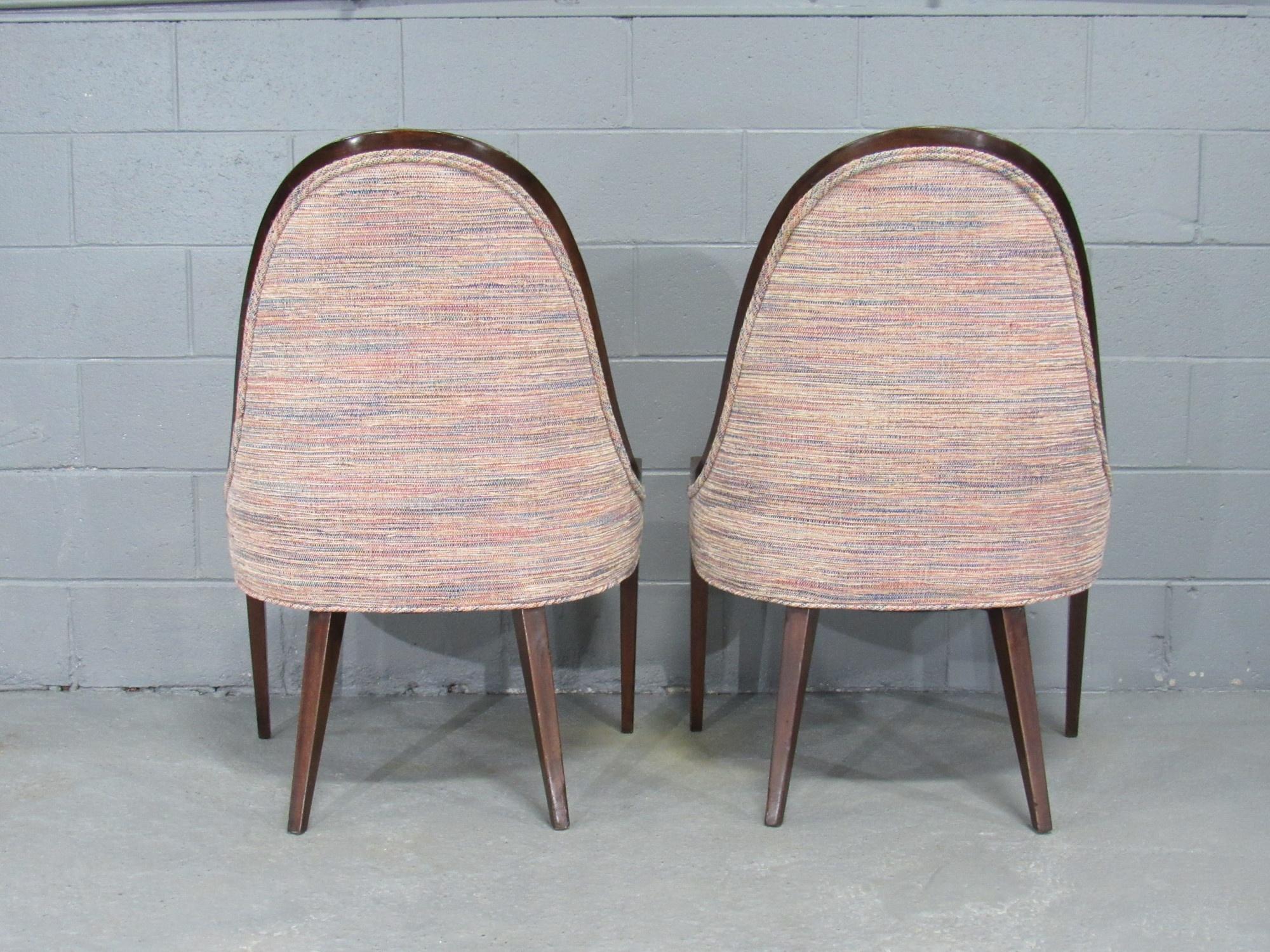 Pair of Mid-Century Modern 1950s gondola slipper chairs with a graceful mahogany frame and splayed rear legs designed by Harvey Probber, American. Chairs have sturdy mahogany frames and upholstered in high-quality fabric.