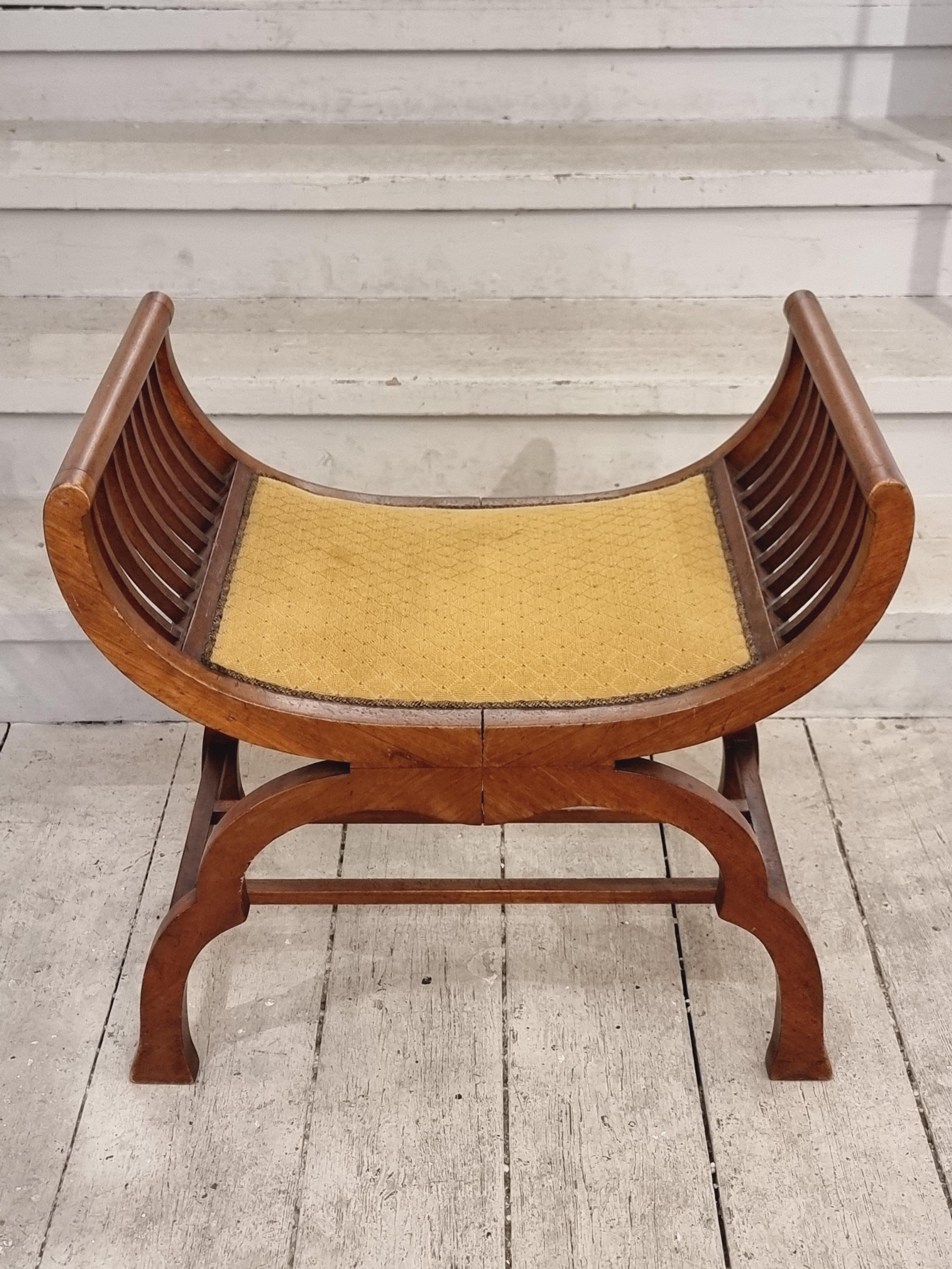 Decorative and functional gondola stool in walnut and original fabric. Wonderful timeless shape which works in most rooms and interiors.  

In good condition, smaller signs of age and wear. A few vague discolorations on fabric.  Stable. 



