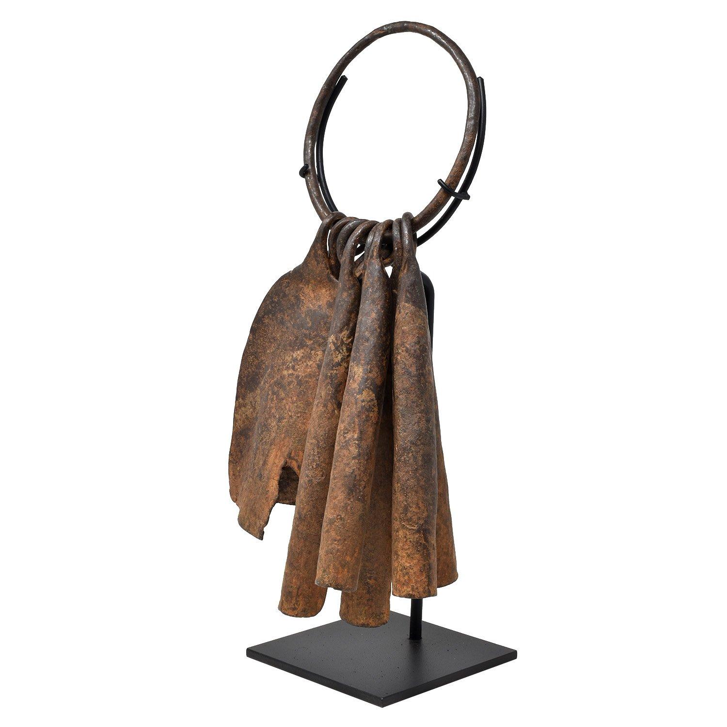 Chamba, Nigeria, Africa

Iron

Early 20th century

14.5 x 7 in. / 37 x 18 cm

Height on custom display stand: 16.5 in. / 42 cm

Various models of these original currency bearers were manufactured by the Chamba tribe. The bearing iron can have an