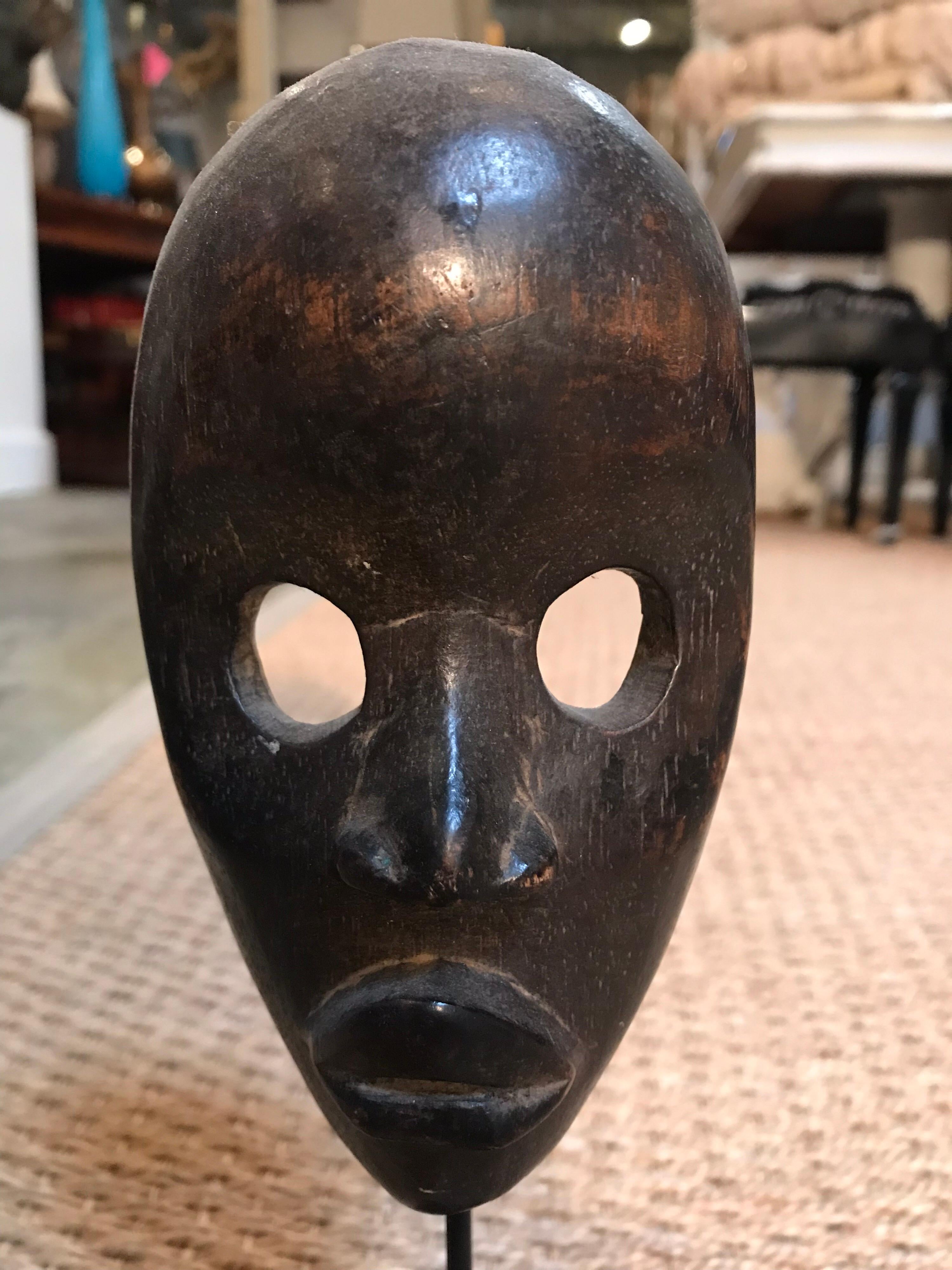 This wooden Gonveia mask is handmade in the Danh Tribe tradition.