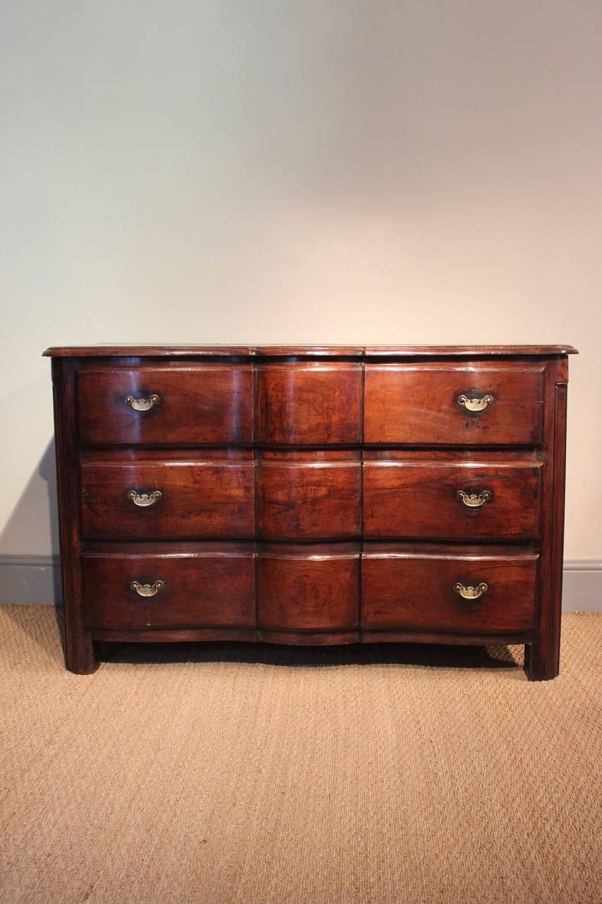 A good quality and of elegant lines, 18th century French serpentine three-drawer commode in walnut with a wonderful color, that will work well in most settings.
 