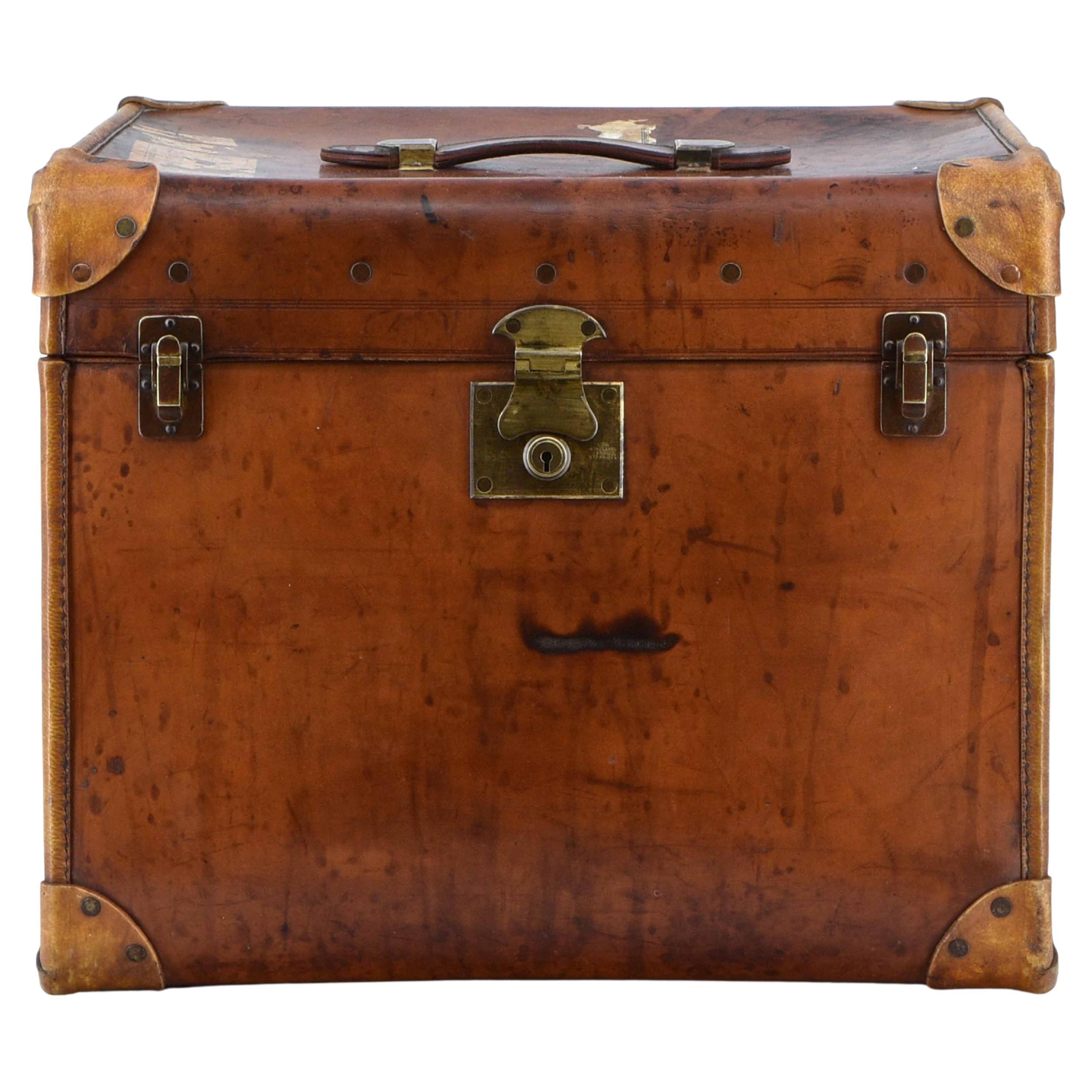A good quality leather luggage trunk dating from the 1930's. 

The trunk has the original lined interior, brass catches and lock. A more unusual shape than most, it would work well as a coffee table or sofa table (as you can see, it looks like it