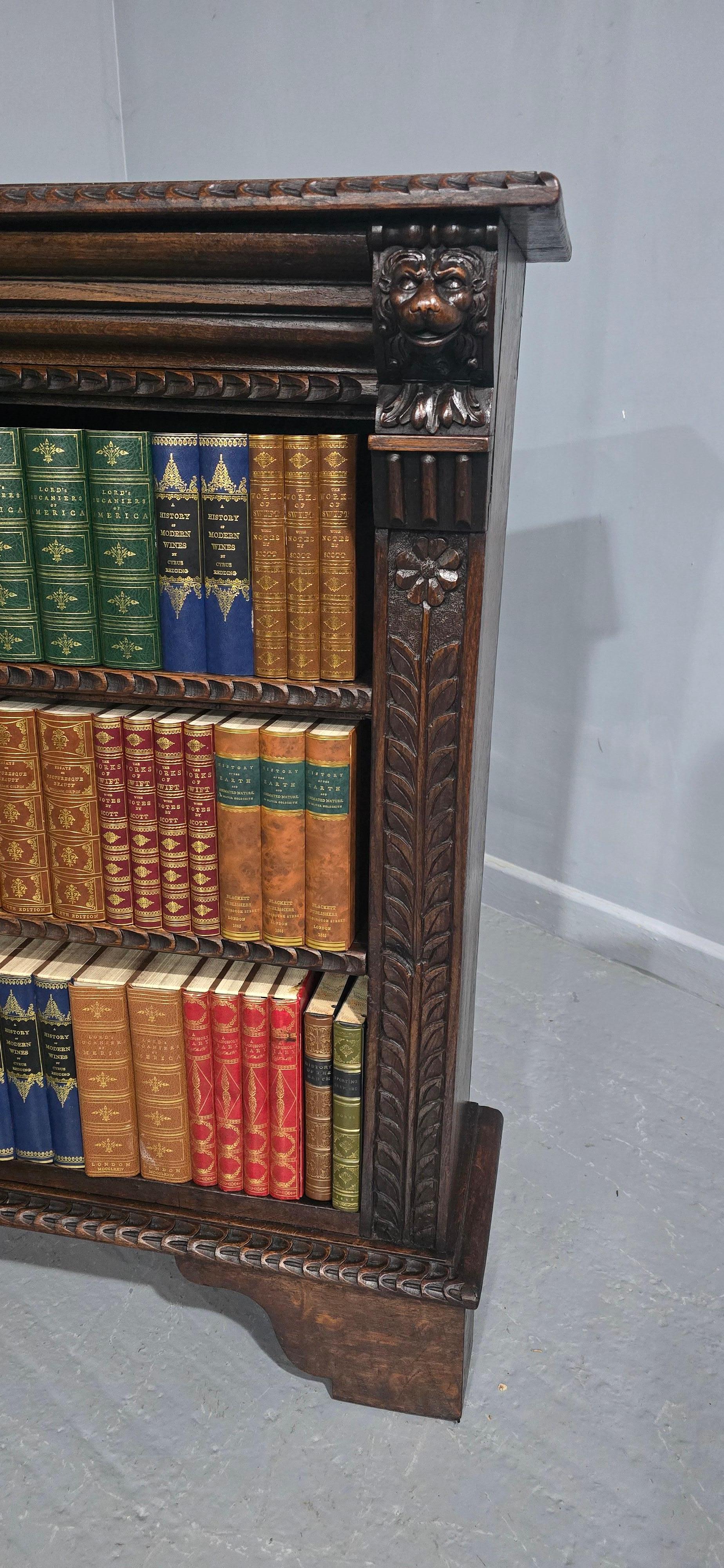 A very good English dark oak carved open library bookcase, having been cleaned and waxed ready for the home.

42.5