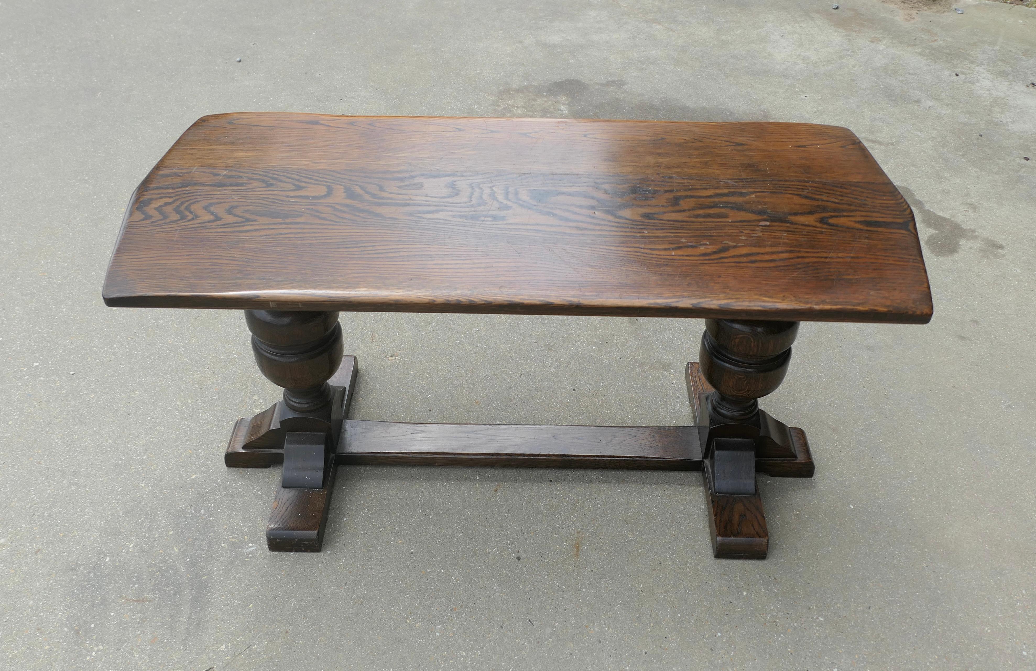 Good Farmhouse Oak Refectory Style Coffee Table 

This is a very sturdy table, made in the Farmhouse refectory style, it is made in solid oak which has a good patina and an attractive grain it has a thick top with slightly pointed ends  and chunky