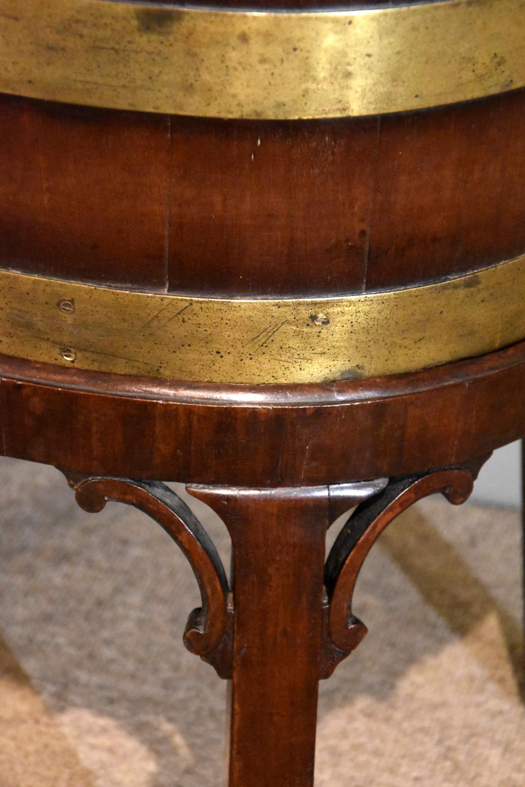 A good George III oval mahogany wine cooler original base later zinc liner, missing tap

Height 23