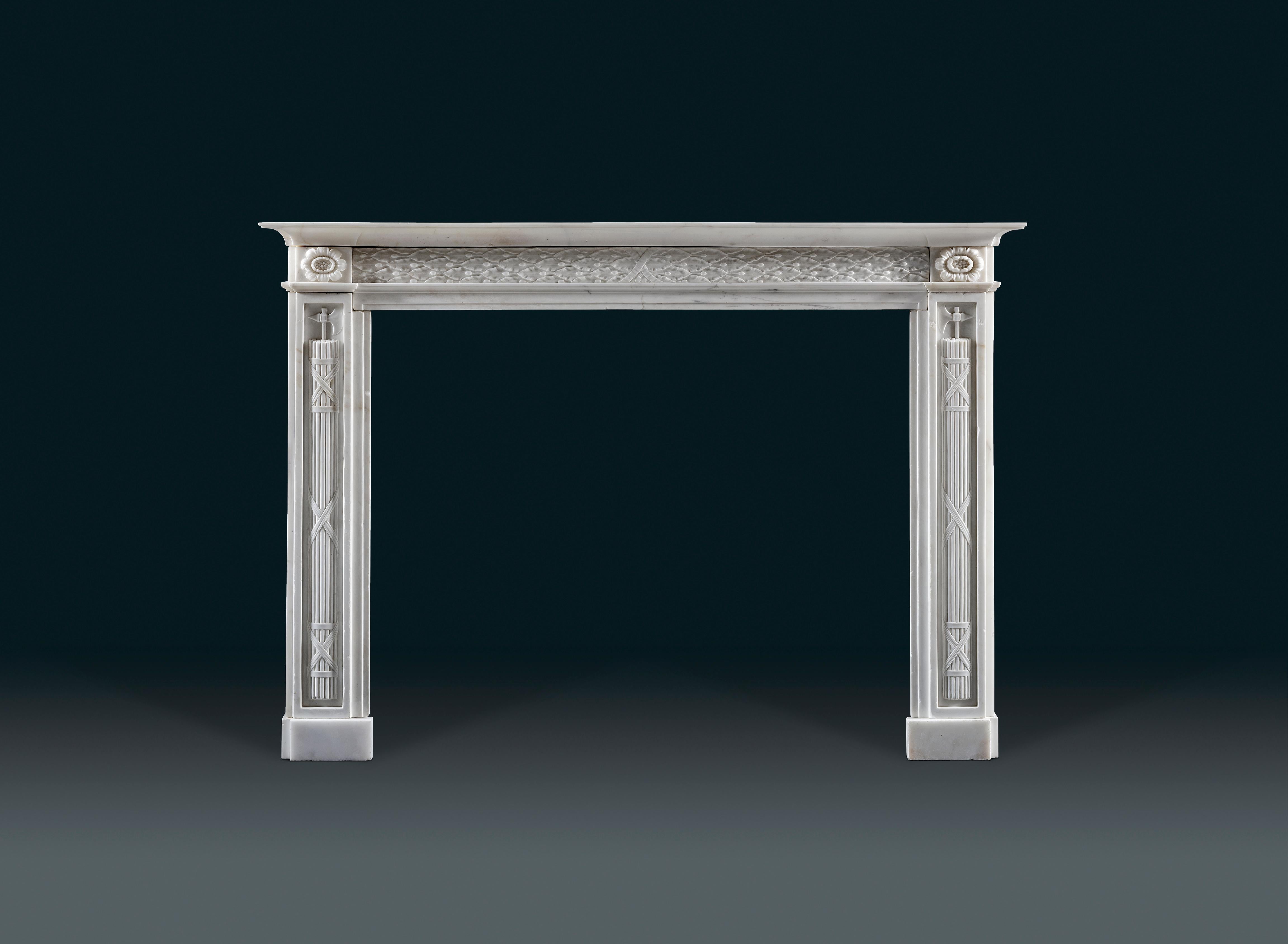 A good late 18th century Italian Statuary marble fireplace with highly symbolic decoration allegorical of the Ancient Roman Republic. With a simple one-piece concave moulded shelf, the frieze decorated with tied laurel leaves emblematic of victory,