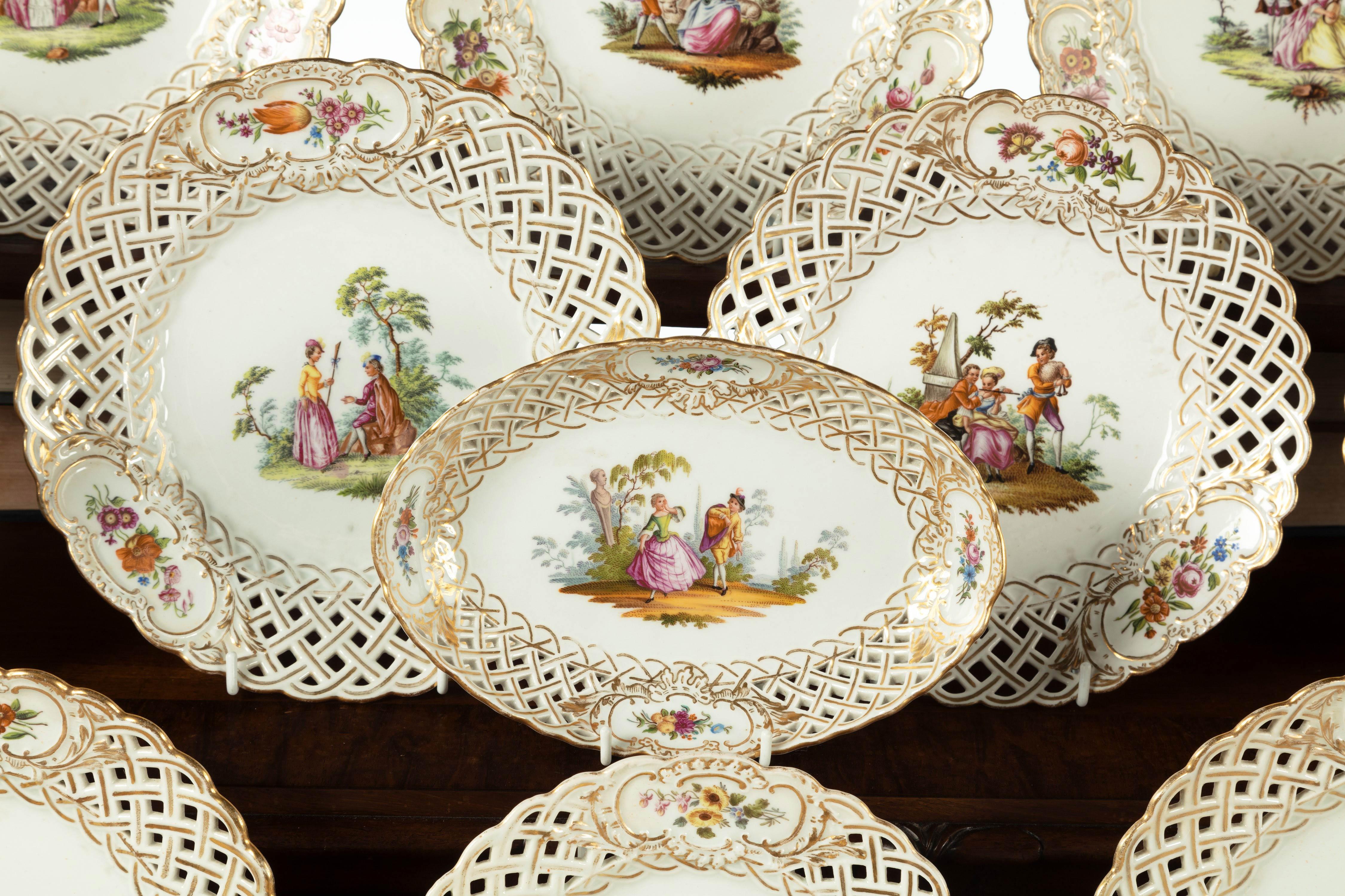 A good late 19th century Meissen porcelain dessert service with pierced, reticulated borders. The central panels of Wyattesque in design. Comprising 26 pieces:

Measures: 16 plates= 9.5 inches
8 plates= 8.5 inches
2 dessert plates= 9 inches.
 
