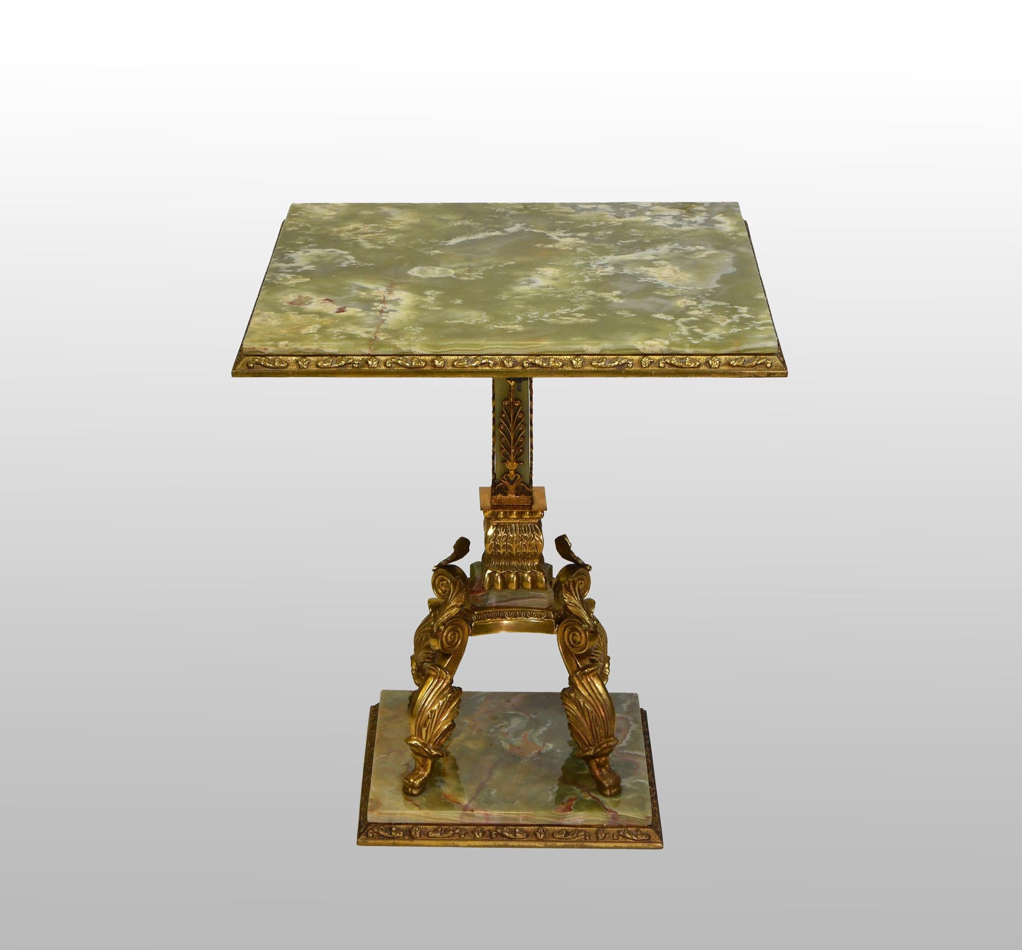 A good quality decorative onyx and brass side table. Circa 1950s.

The table stands on four scrolled pad feet with central pedestal. The oynx shows superb graining, there are a few surface marks with age.

There is a hairline in the oynx to
