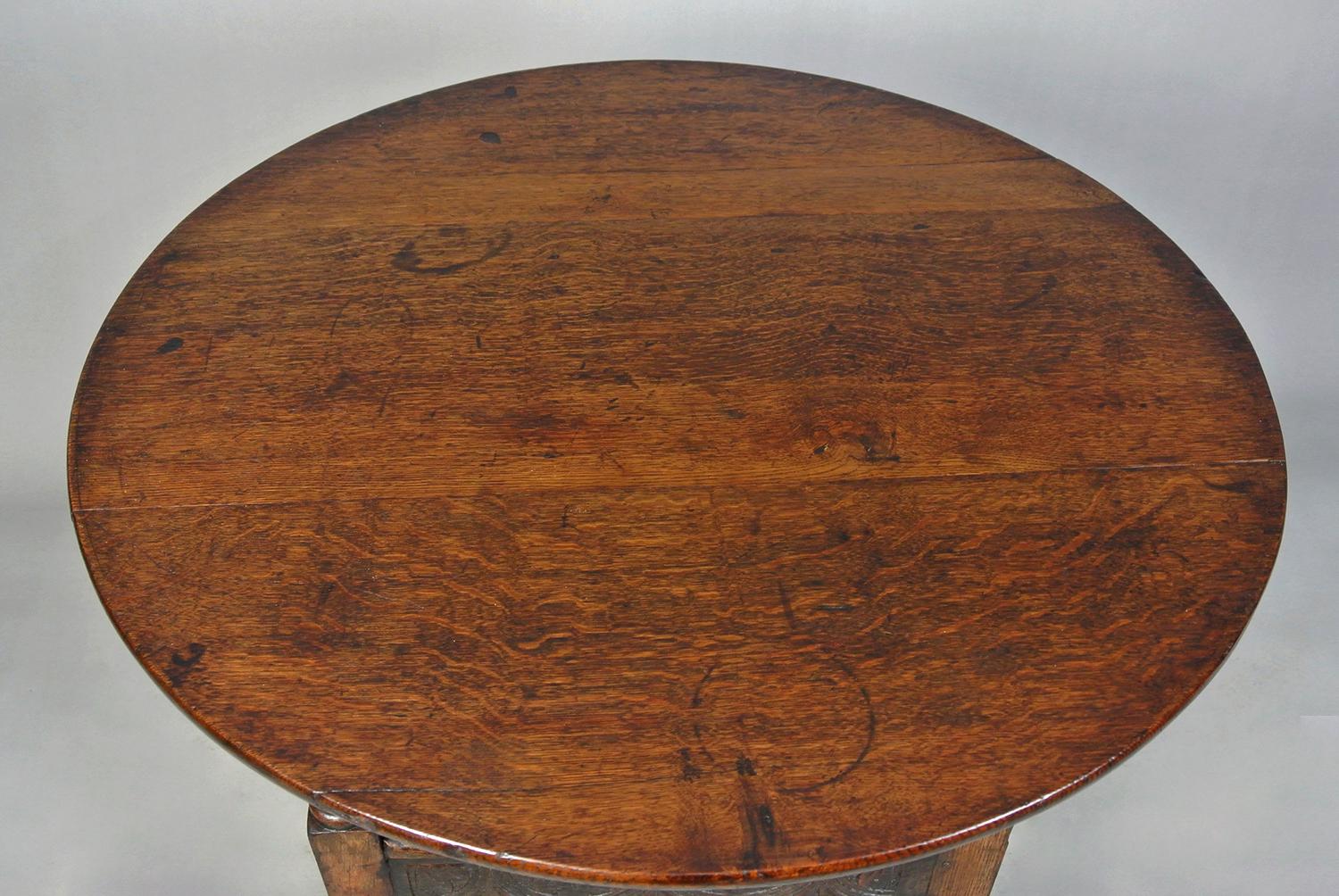 A good oak monk’s table with original timbers throughout.

This is a beautiful side table with a lovely rich colour and patination which can easily convert to a chair, the top pivots up to form the back panel of the chair.

The oak cut to reveal the