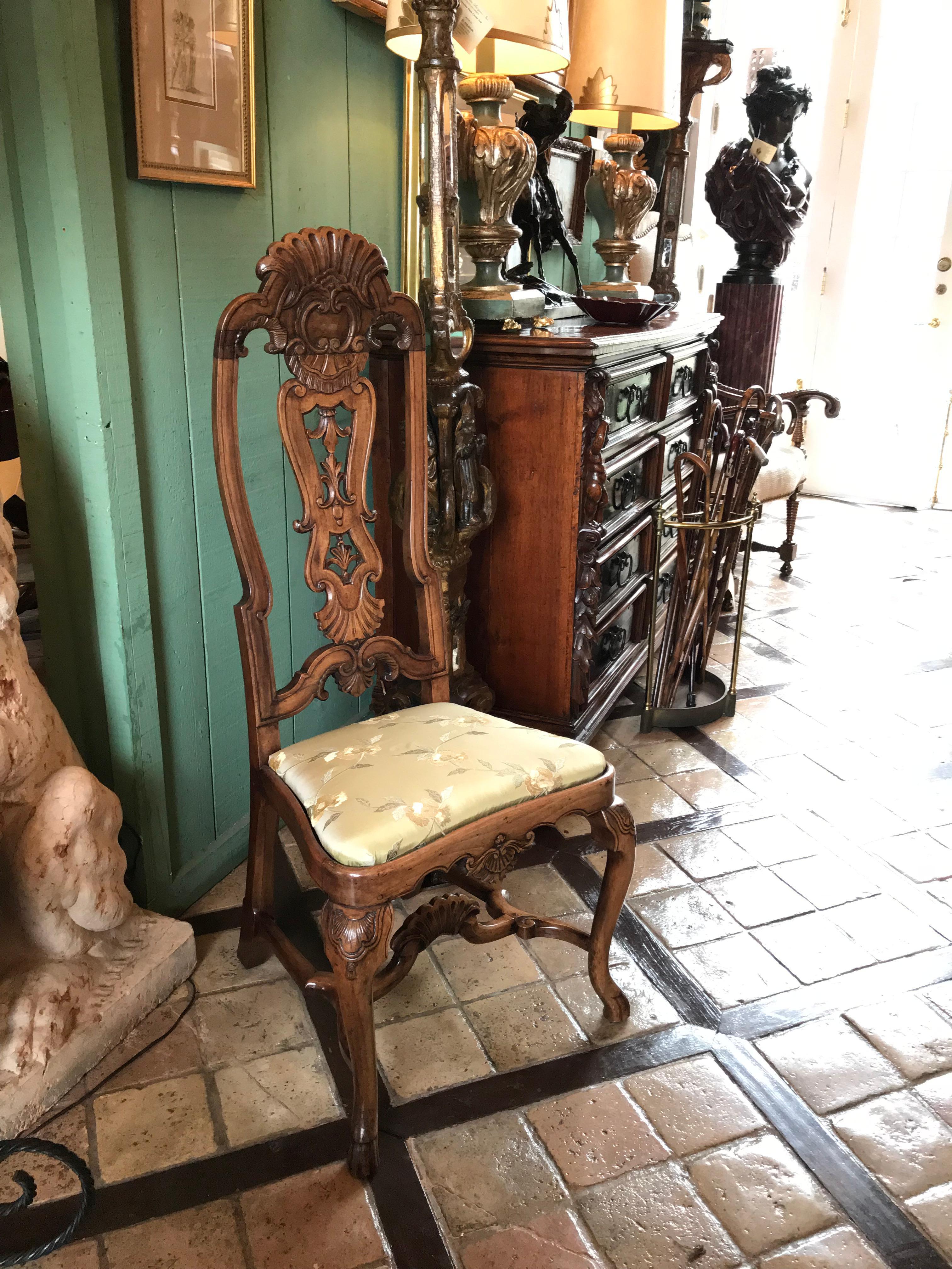 Good pair of 18th century Portuguese Colonial carved palisander wood side chairs. 

Portuguese furnishings of the 18th century are bold, quirky, intensive and unlike those of any other country. They have their own national flavour. The pieces