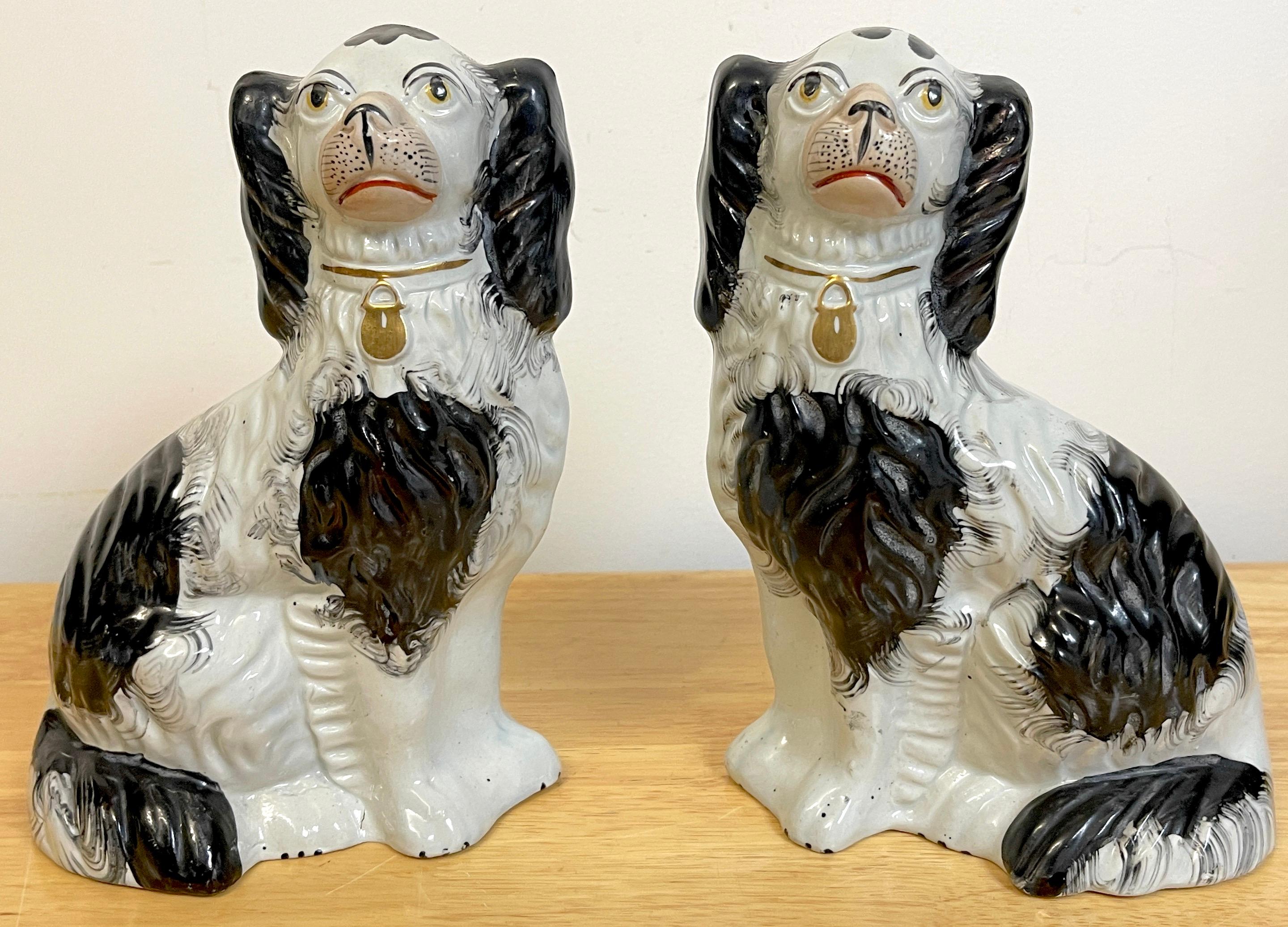 Good pair of 19th c Staffordshire black & white spaniels, well painted with expressive faces, each dog stands 9