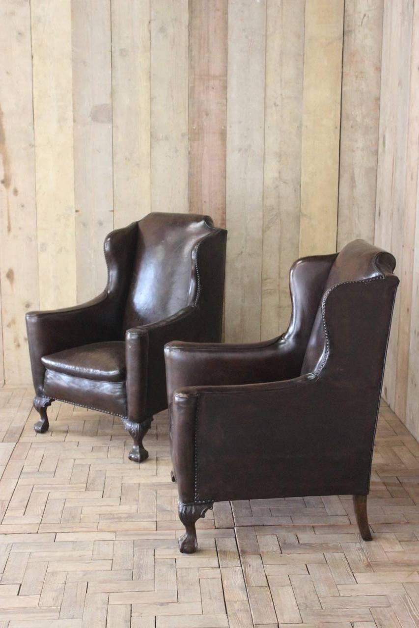 A smart pair of early 20th century English wingback library armchairs, in their original leather, with a good color that will work well in most settings. 

Measures: Seat height 42cm.
 