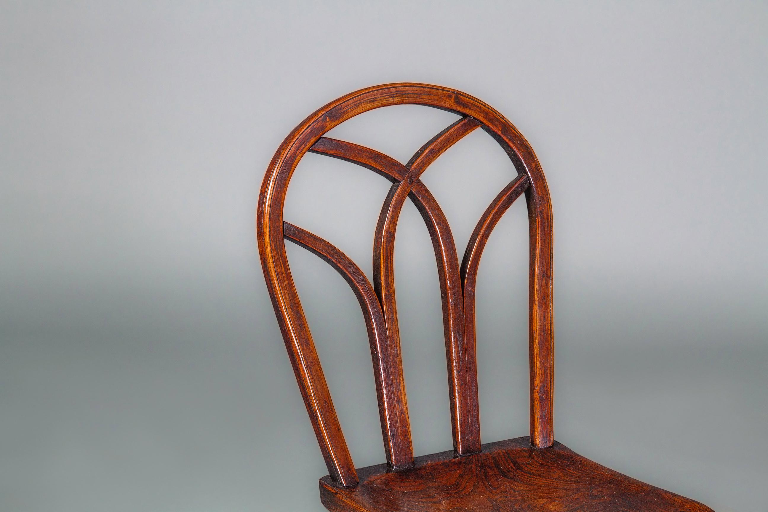 This modified Gothic style of Windsor chairs is attributed to the Buckinghamshire area of the Thames Valley and examples are known from circa 1790 through the first half of the 19th century. Although some are found with crinoline stretchers, these