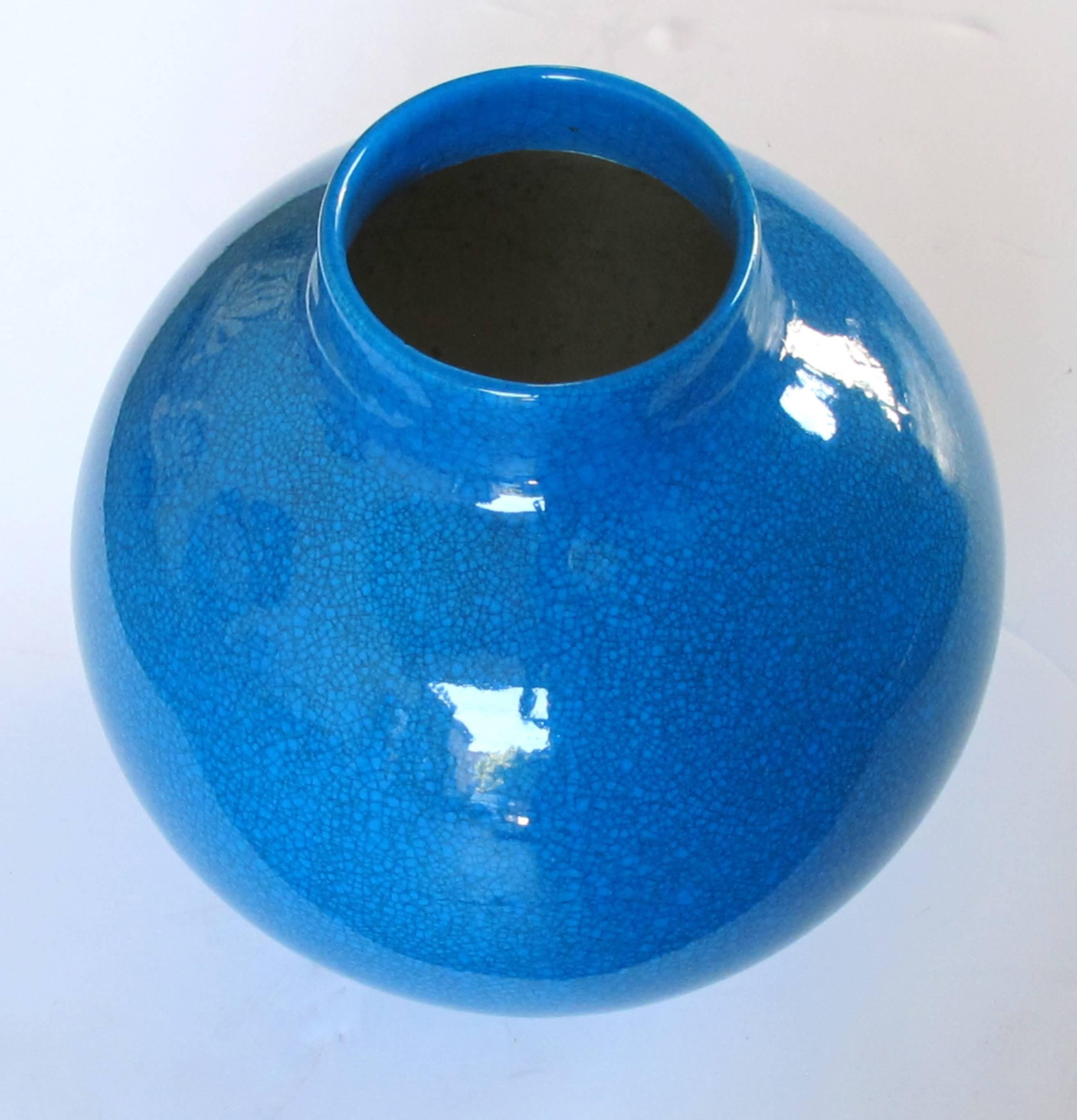 With short neck above a spheroid body; in a richly colored blue crackle-glaze; ink stamp to underside 'Boch Freres, La Louviere'.