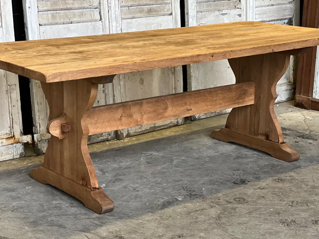 A nice practical good quality solid oak farmhouse dining table. Fully comes apart for easy access into the home, deeper than normal for this length, good end overhang for a chair to slide under and having been bleached a nice light colour.
In