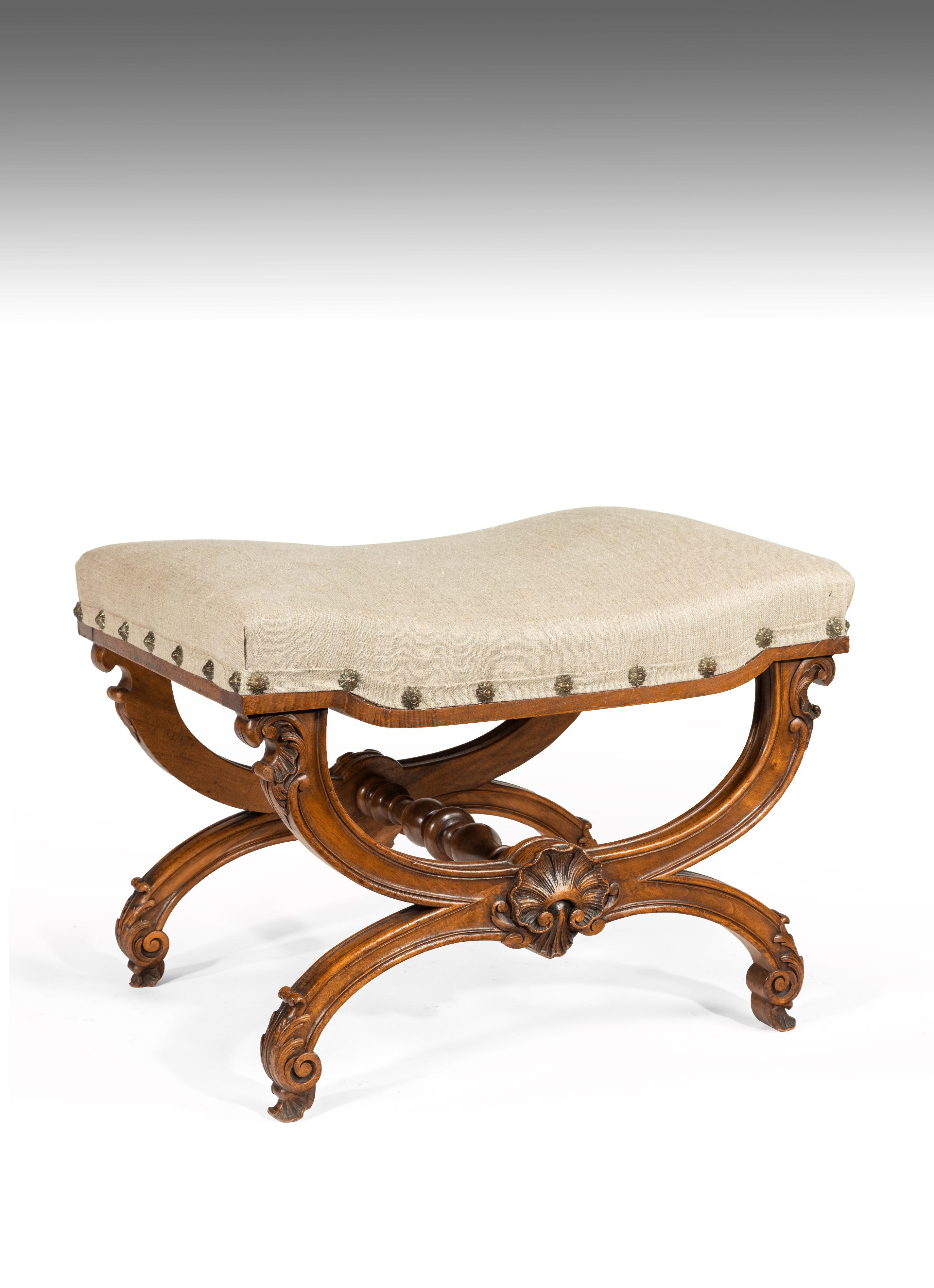 A good quality late 19th century walnut curule stool / x frame stool covered in linen.

French circa 1860-1880

Of excellent form, the shaped saddle seat having been recently recovered in a neutral linen fabric whilst retaining the original