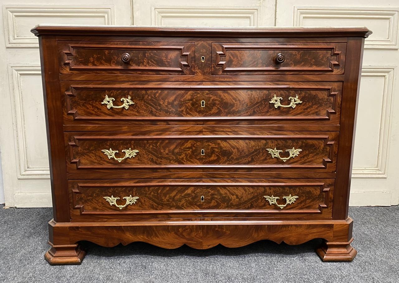 A simply stunning quality French Commode Chest of Drawers with white marble top.
Made from flame Cuban Mahogany in the 1840s and having oak lined drawers, Original ormolu handles and original marble inset top. The drawers all run smoothly. 
This
