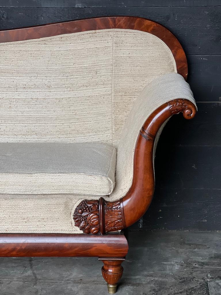 An excellent quality French Mahogany Empire Regence period Settee, Sofa or Couch. The Mahogany is high quality Cuban Mahogany having a lovely original patina and colour. Nice end carved detailing and brass cups to the feet. The upholstery is in very