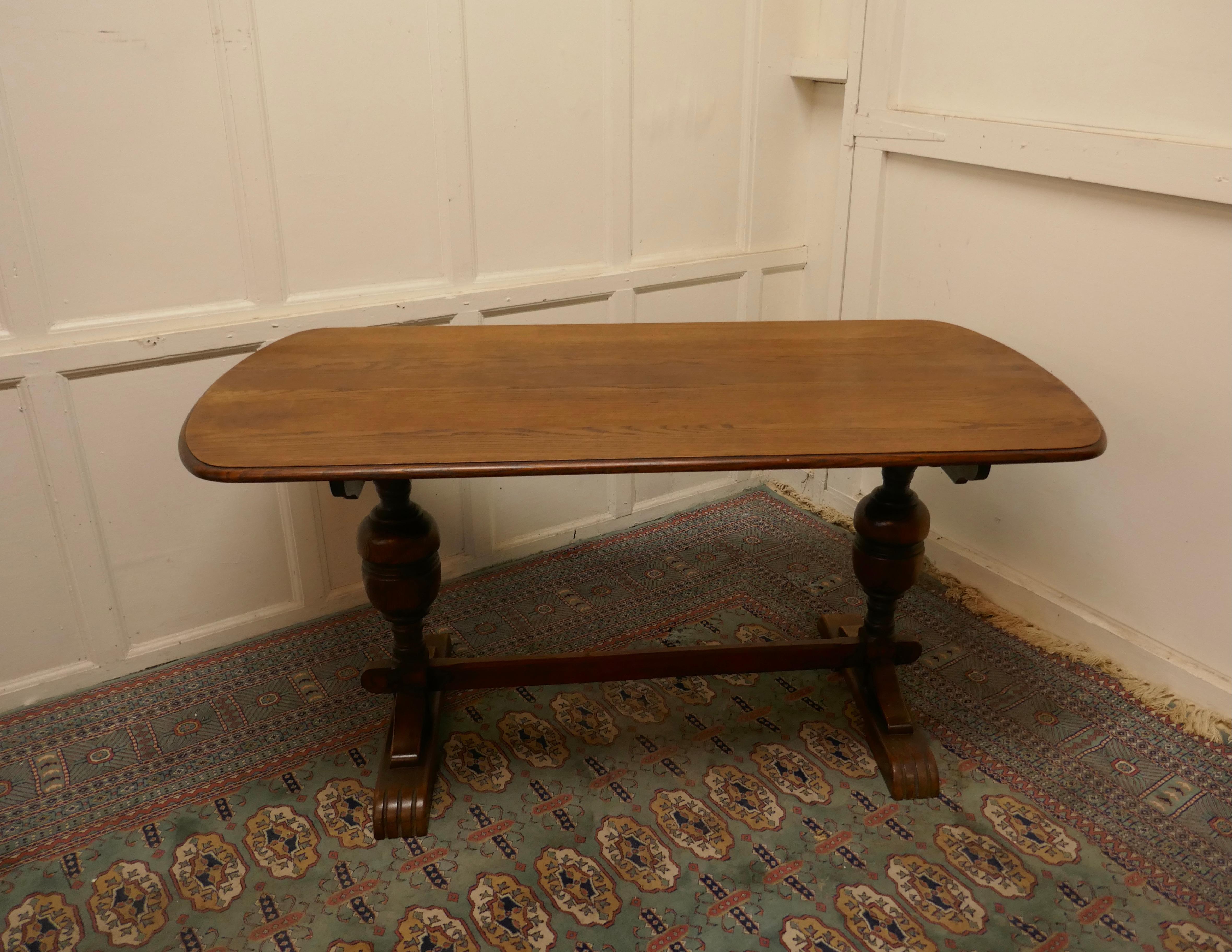 Good quality oak refectory dining table

This is a Superb piece it is a good quality Country oak table in the a refectory style, the table top has a moulded edge with a delightful shape, rectangular with a curved end (Squoval). The legs are chunky