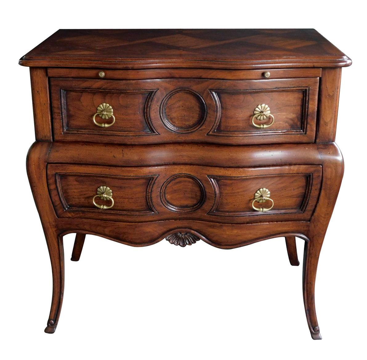 Super good quality with elegant shape and small size, the serpentine parquetry top above a bombé body fitted with 2 oak-lined drawers all raised on splayed legs ending in hoof feet; maker's label 'Auffray & Co. NYC