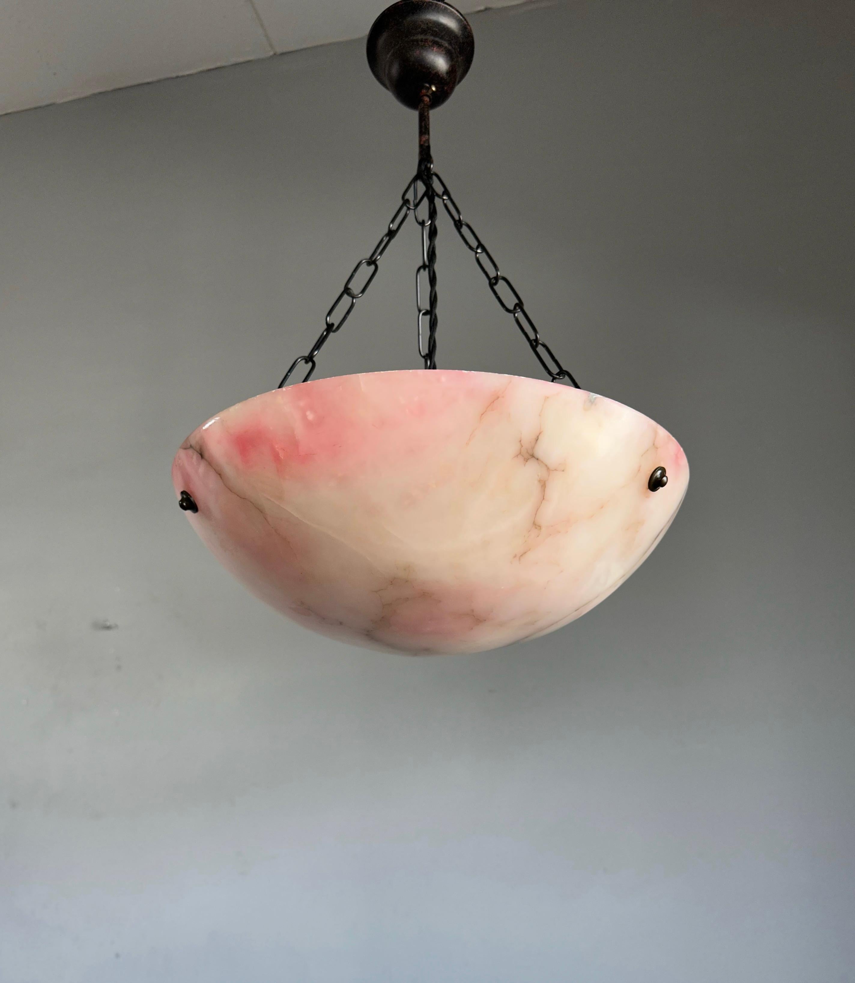 Unique 1920s white alabaster and black veins pendant with a shade of pink.

One of the qualities of alabaster pendants is that no two shades will ever be exactly the same. Mother nature created the mineral stone alabaster over the course of many