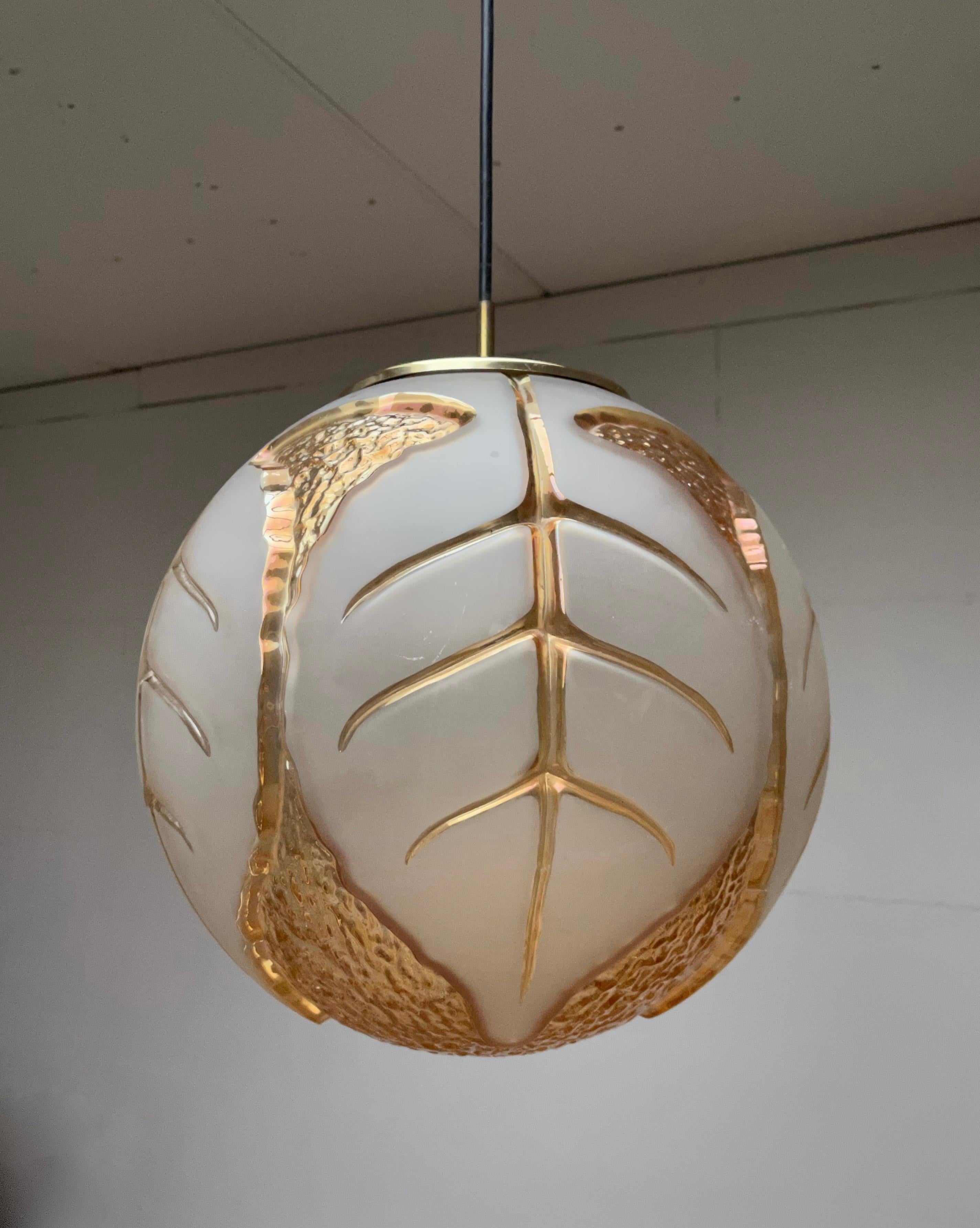 Stunning, midcentury made art glass light fixture.

If you looking for a unique art glass pendant with an organic design then this mother nature inspired pedant could be perfect for your living space. The unique manner in which the beech leafs in