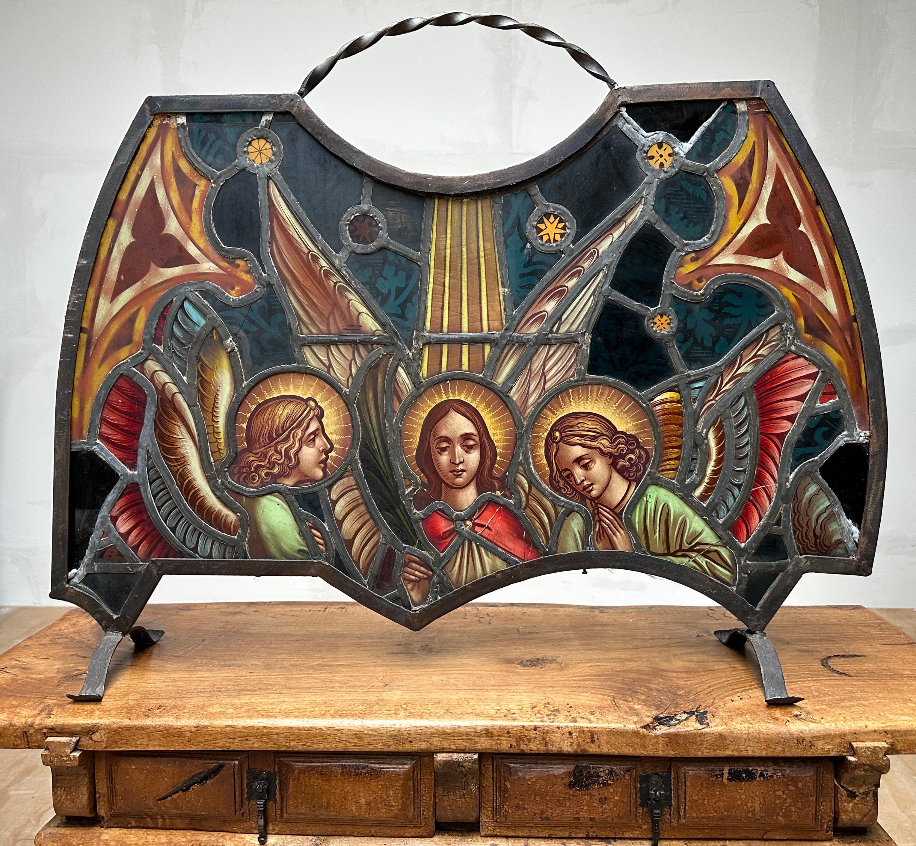 Stunning antique work-of-art-firescreen with (arch) angels in great colors.

This all handcrafted firescreen from the early 1900s definitely is a one of a kind antique. Especially in this hasty, modern era more and more people are starting to