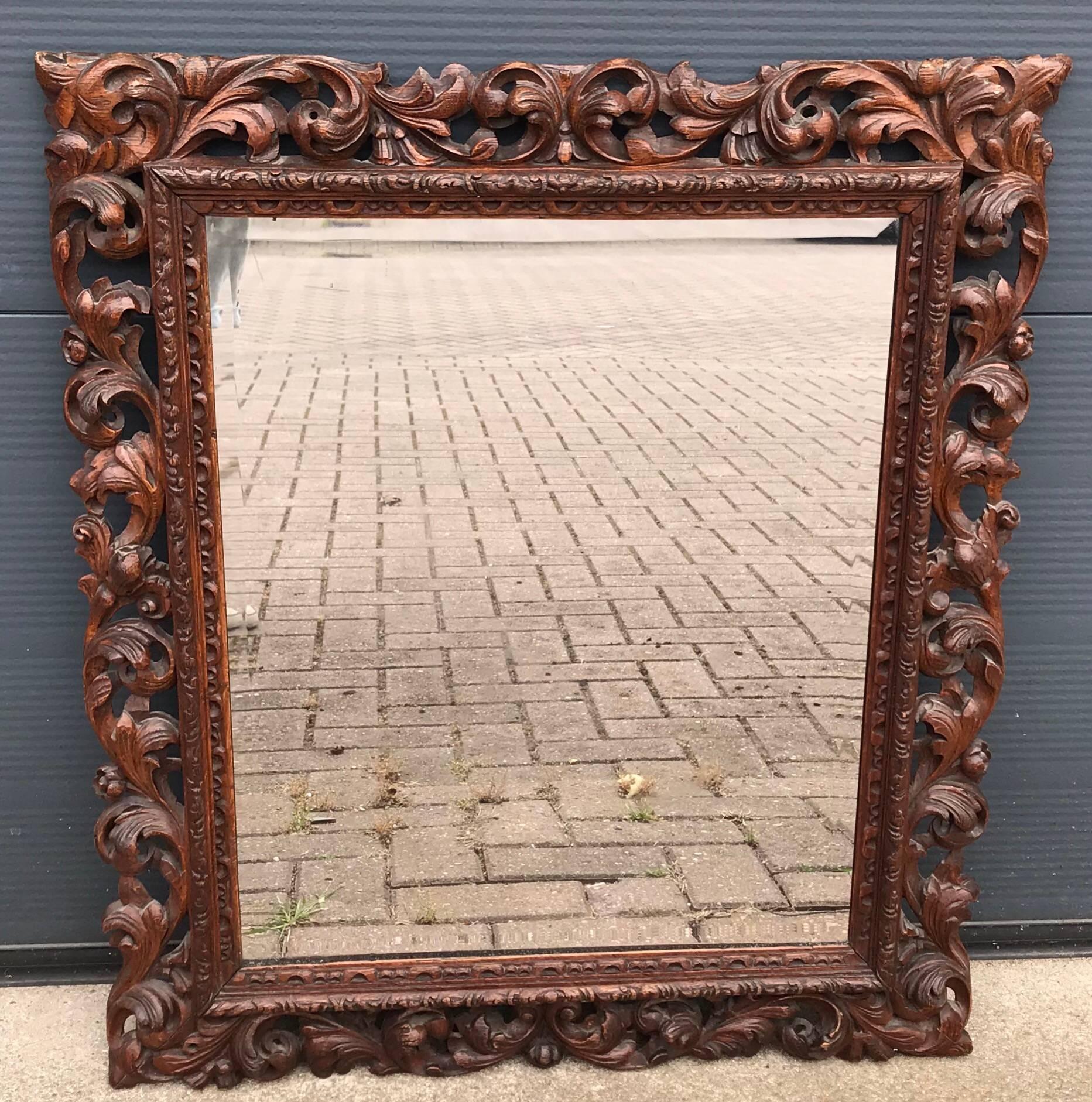 Highly decorative, quality carved antique mirror. 

This beautiful, late 19th century, hand-carved antique mirror frame is in great condition. It is perfectly carved with scrolling acanthus leafs and wild flowers and it has the most beautiful