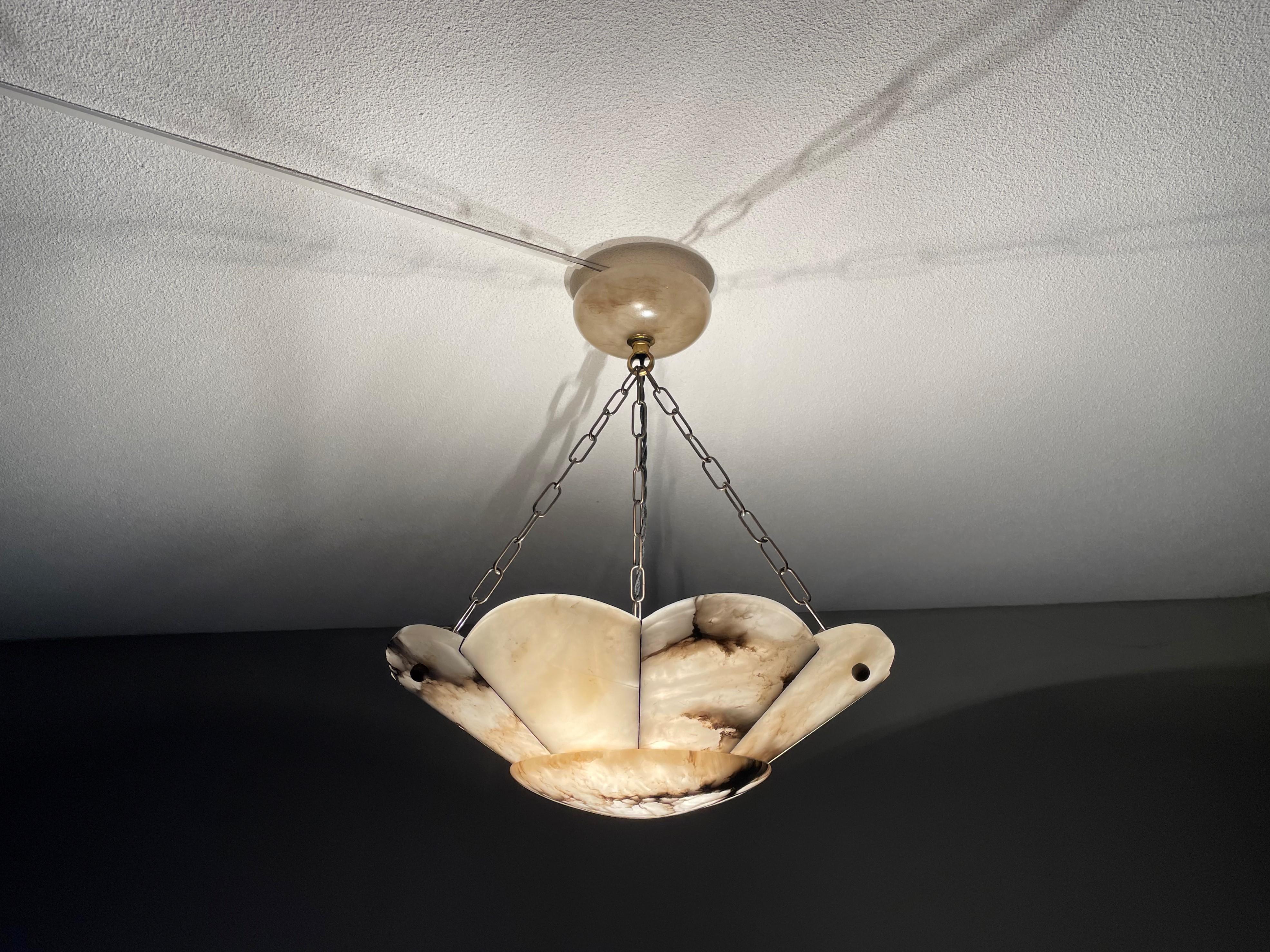 Top class, Arts & Crafts era chandelier with a unique alabaster shade and perfect canopy.

Thanks to its large size and truly excellent condition this alabaster chandelier will light up both your days and evenings. It is all hand-crafted in the