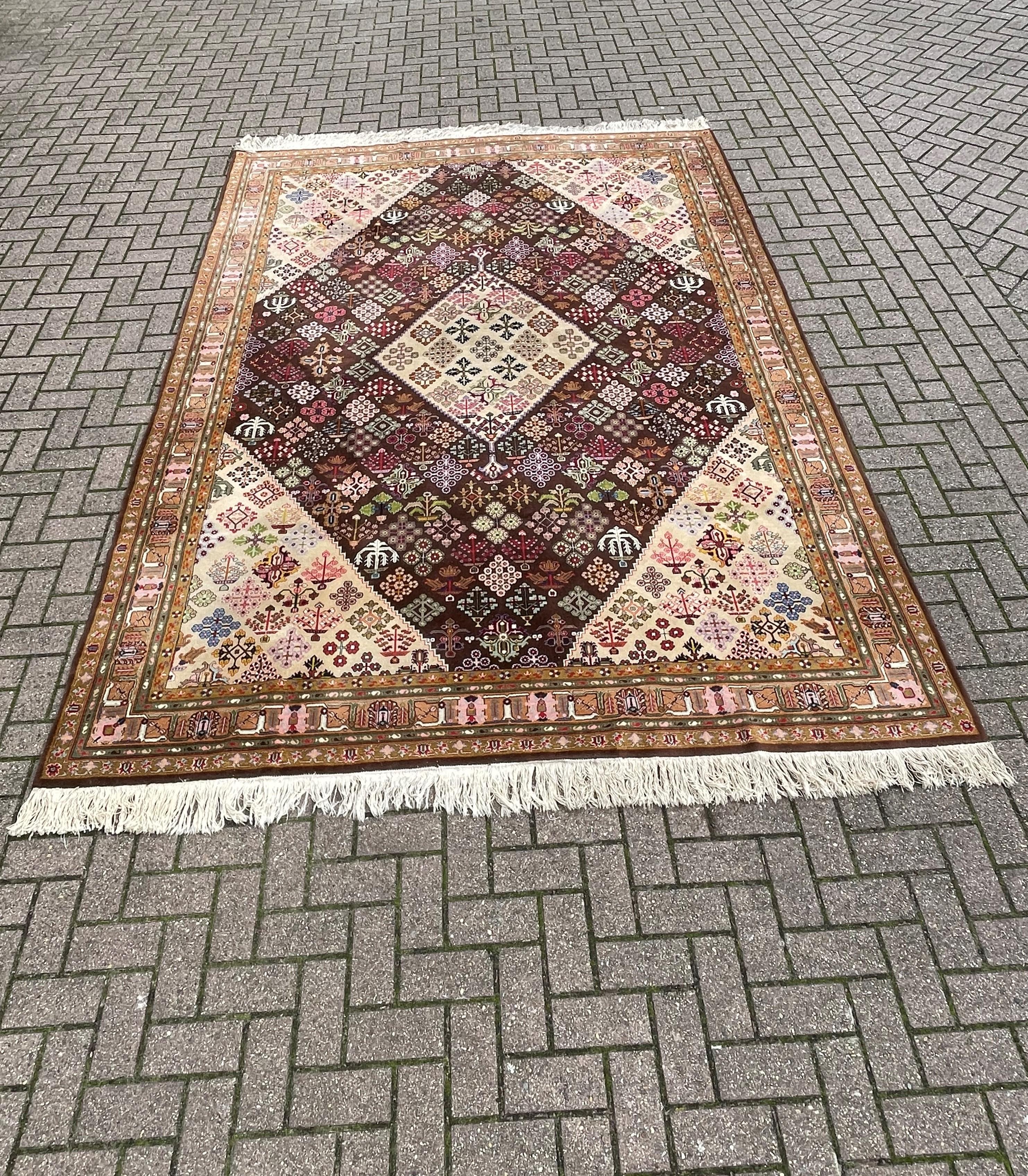 Rare and superb condition, vintage rug with wonderful patterns and 'happy colors'.

When it comes to decorating the floor of your home we cannot think of a better way then with a good quality and clean rug. This good size, stylish and hand-knotted