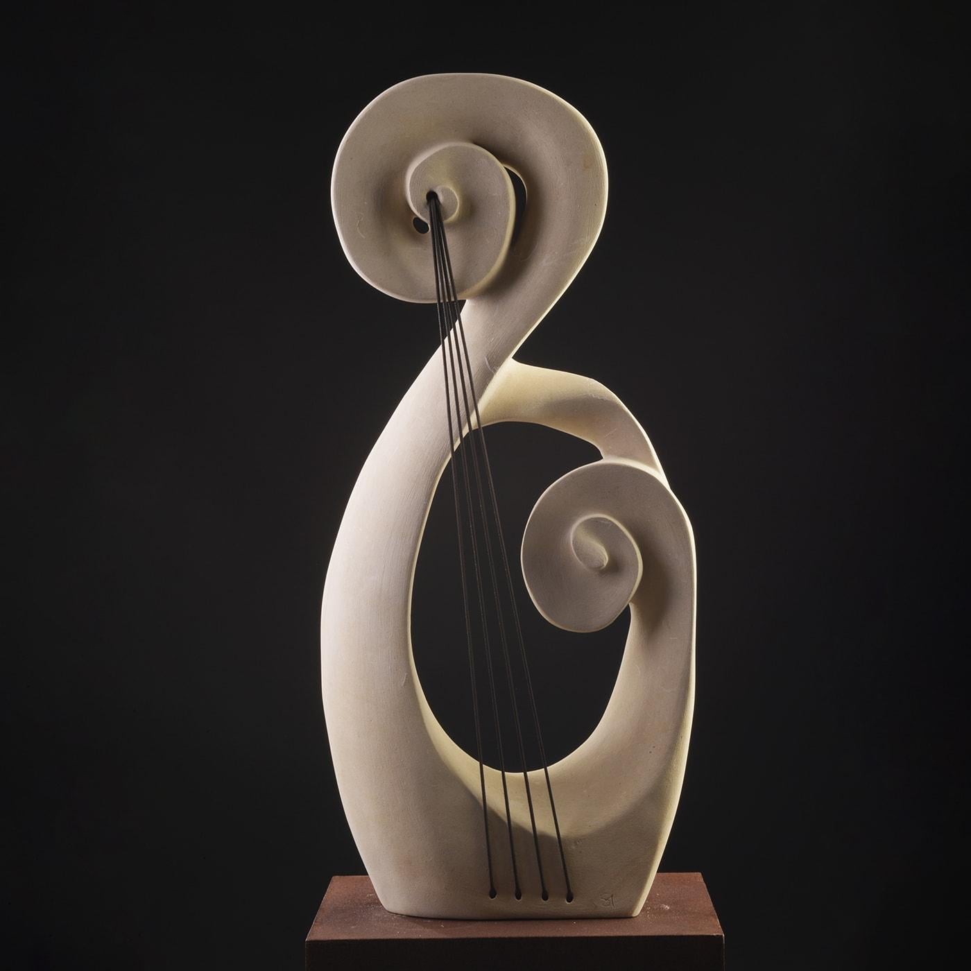  The Good Vibes is a sculptural piece carved from lecce stone, characterized by flowing, organic shapes intertwined with taut strings. This artwork marries natural textures with symbolic tension, reflecting the connection between emotions and inner