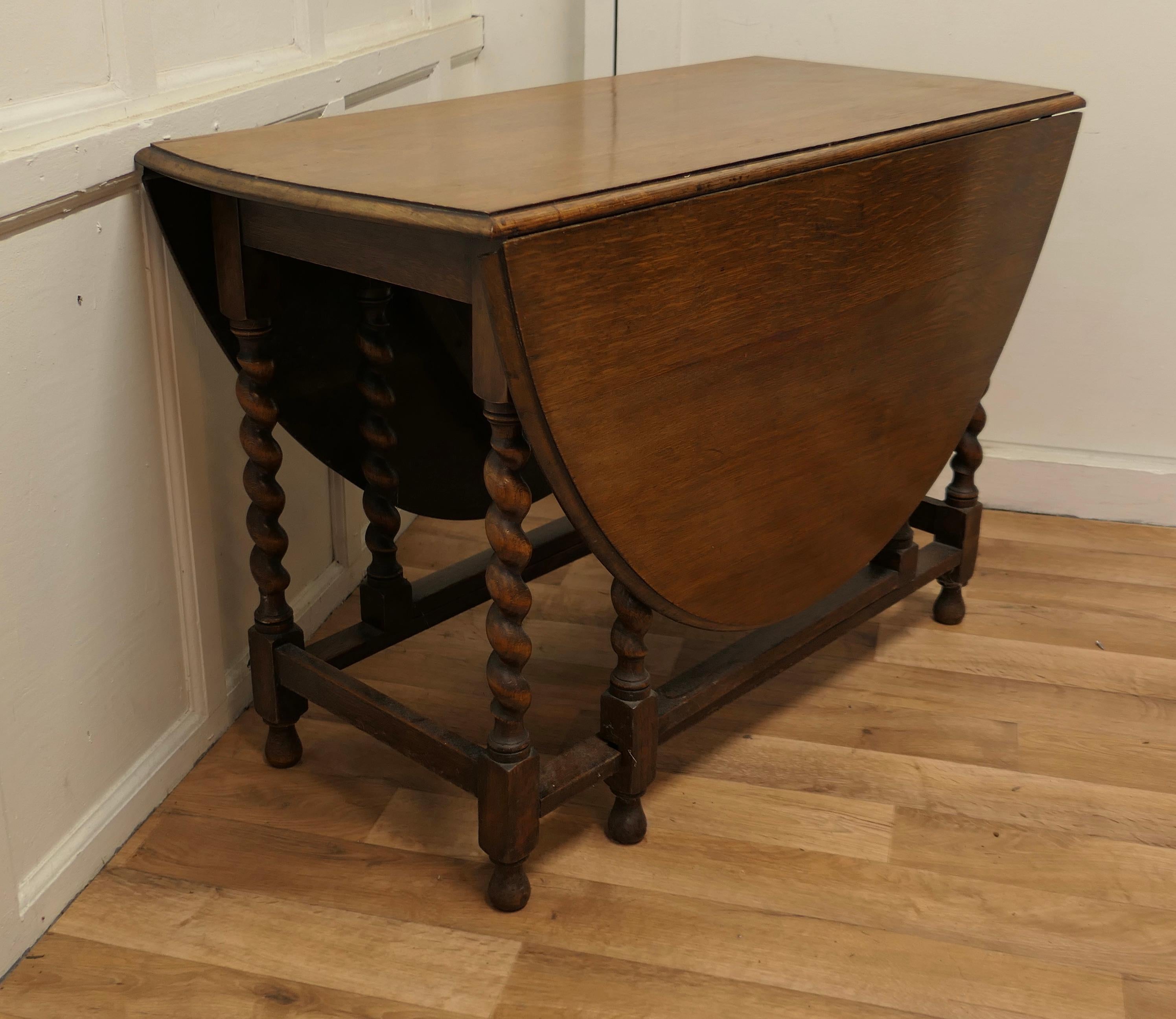 Good Victorian solid oak barley twist gate leg dining table

This is a good solid oak Victorian gate leg table, it 5ft long when open and will seat 6 diners
The table is Oval and made from solid Oak it has elegant crisply turned barley twist legs