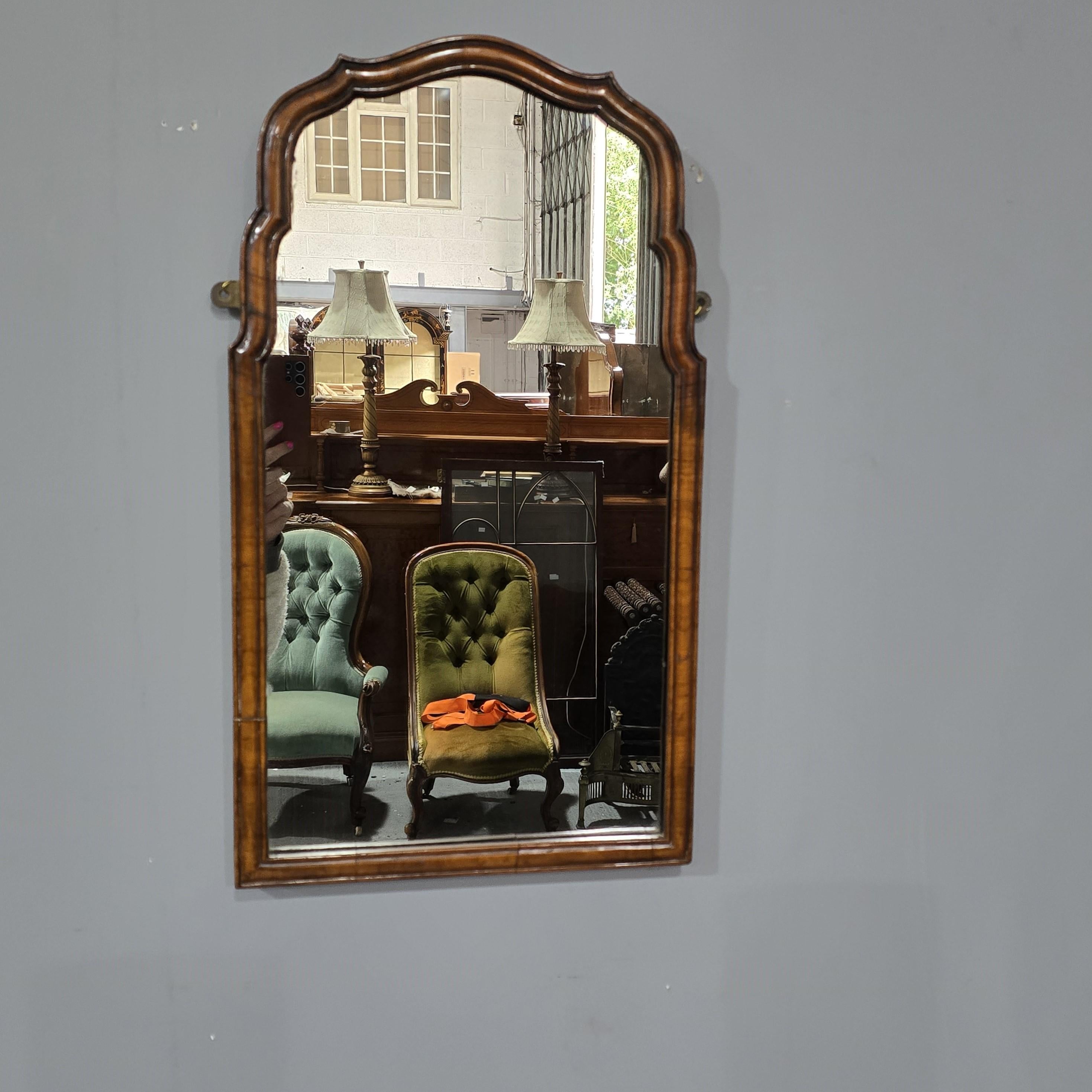 A very nice shaped Queen Anne style walnut wall mirror with original mirror plate, in overall super condition.

25.5