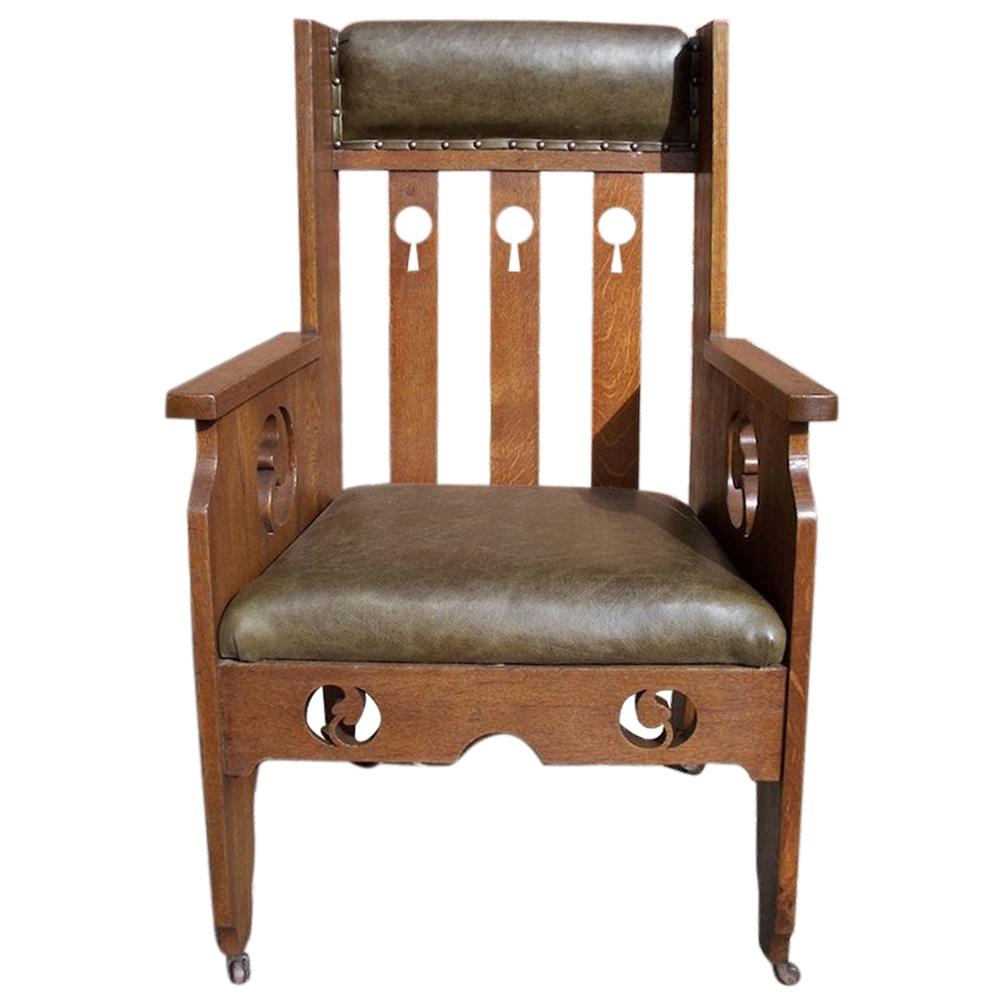 Goodyers of Regent St. an Arts & Crafts Oak Armchair with Stylized Decoration For Sale