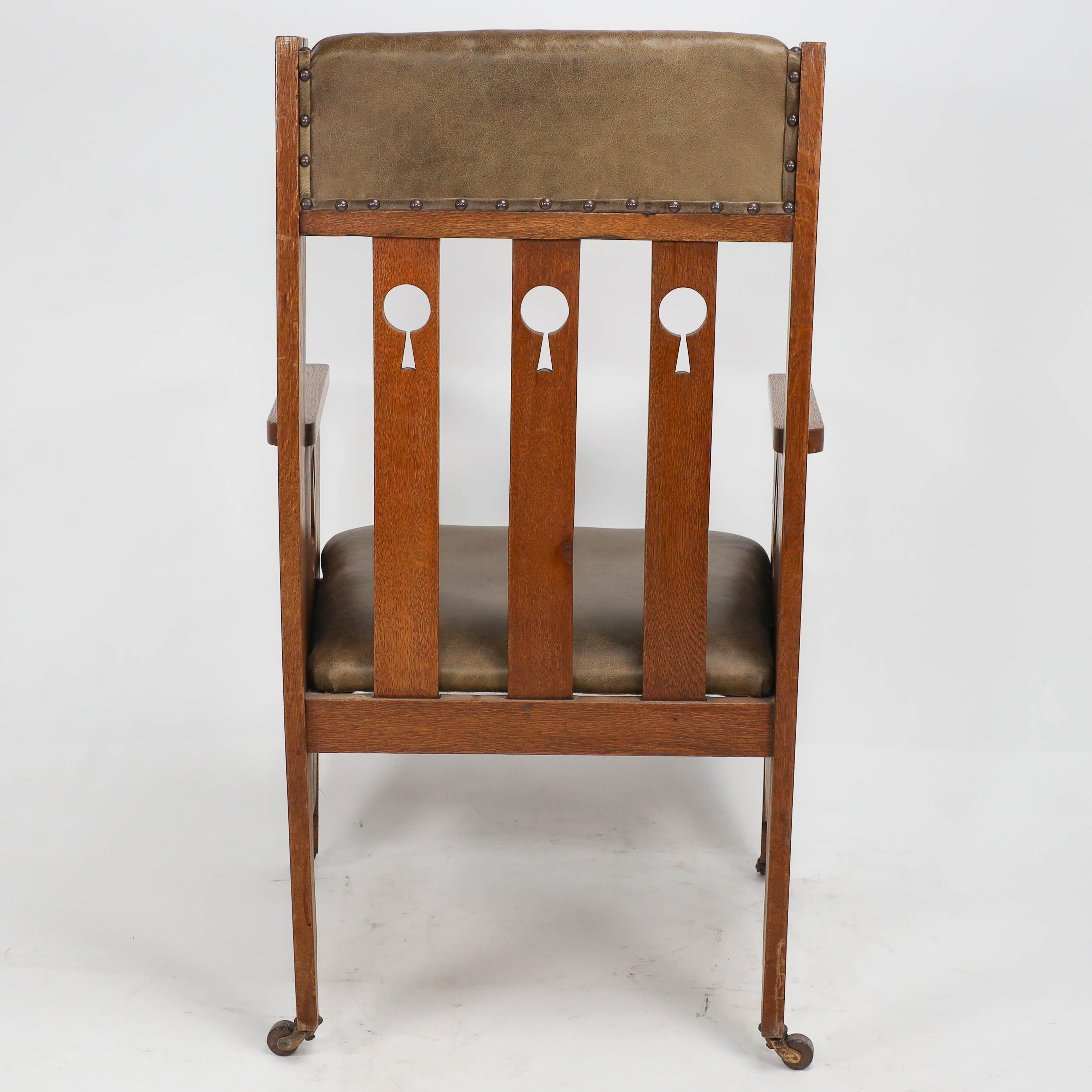 Goodyers of Regent St. An Arts & Crafts oak armchair with stylized decoration For Sale 5