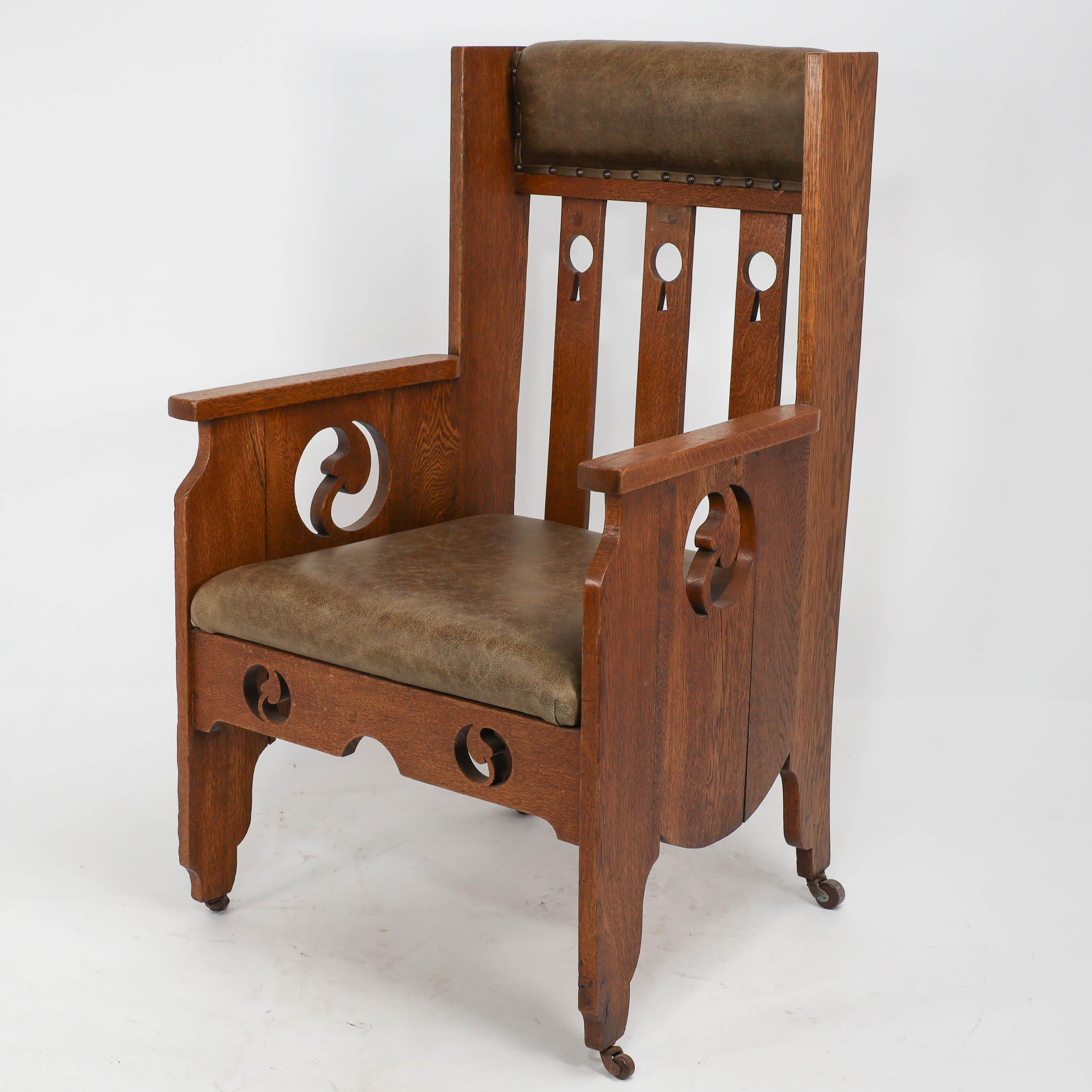 Arts and Crafts Goodyers of Regent St. An Arts & Crafts oak armchair with stylized decoration For Sale