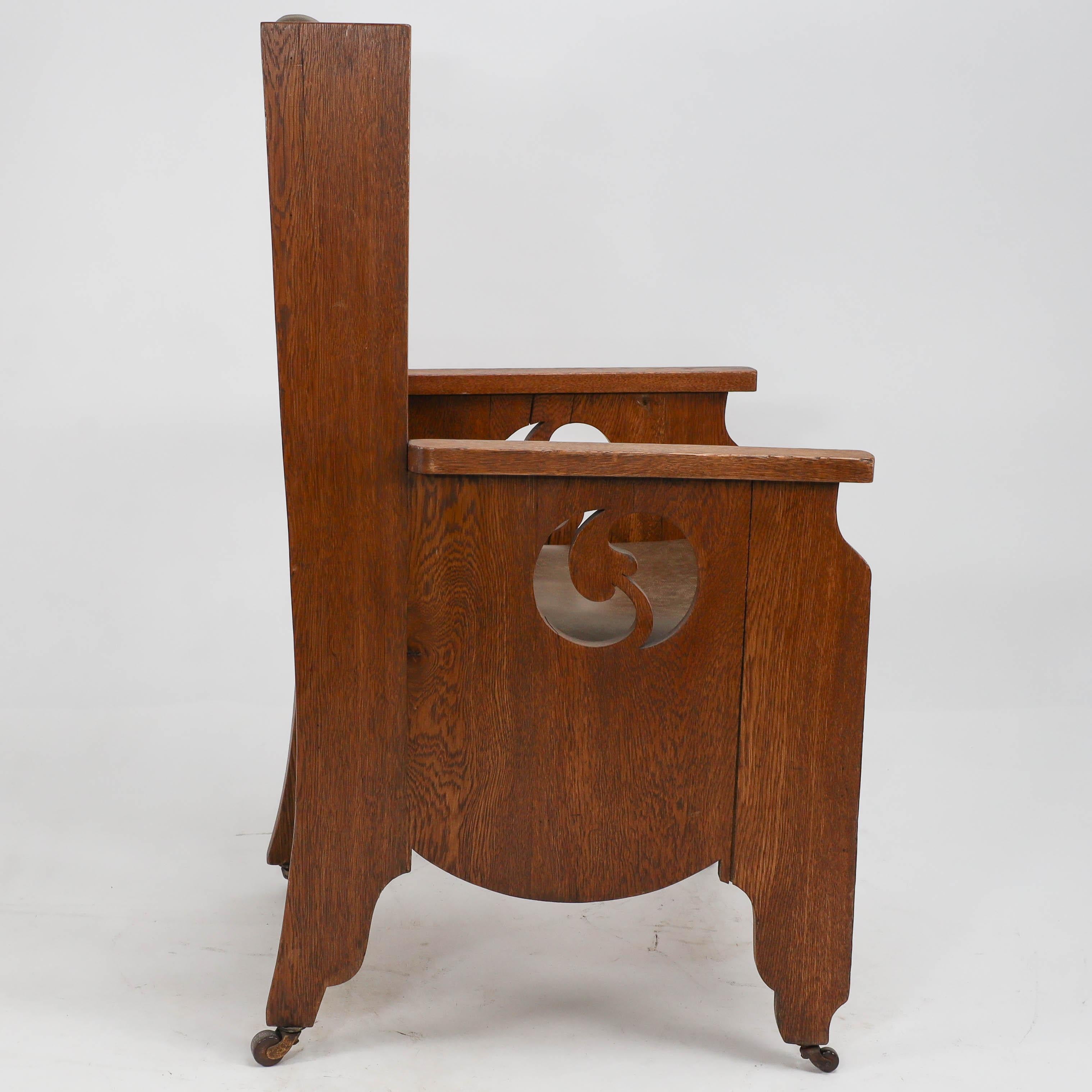 Hand-Crafted Goodyers of Regent St. An Arts & Crafts oak armchair with stylized decoration For Sale