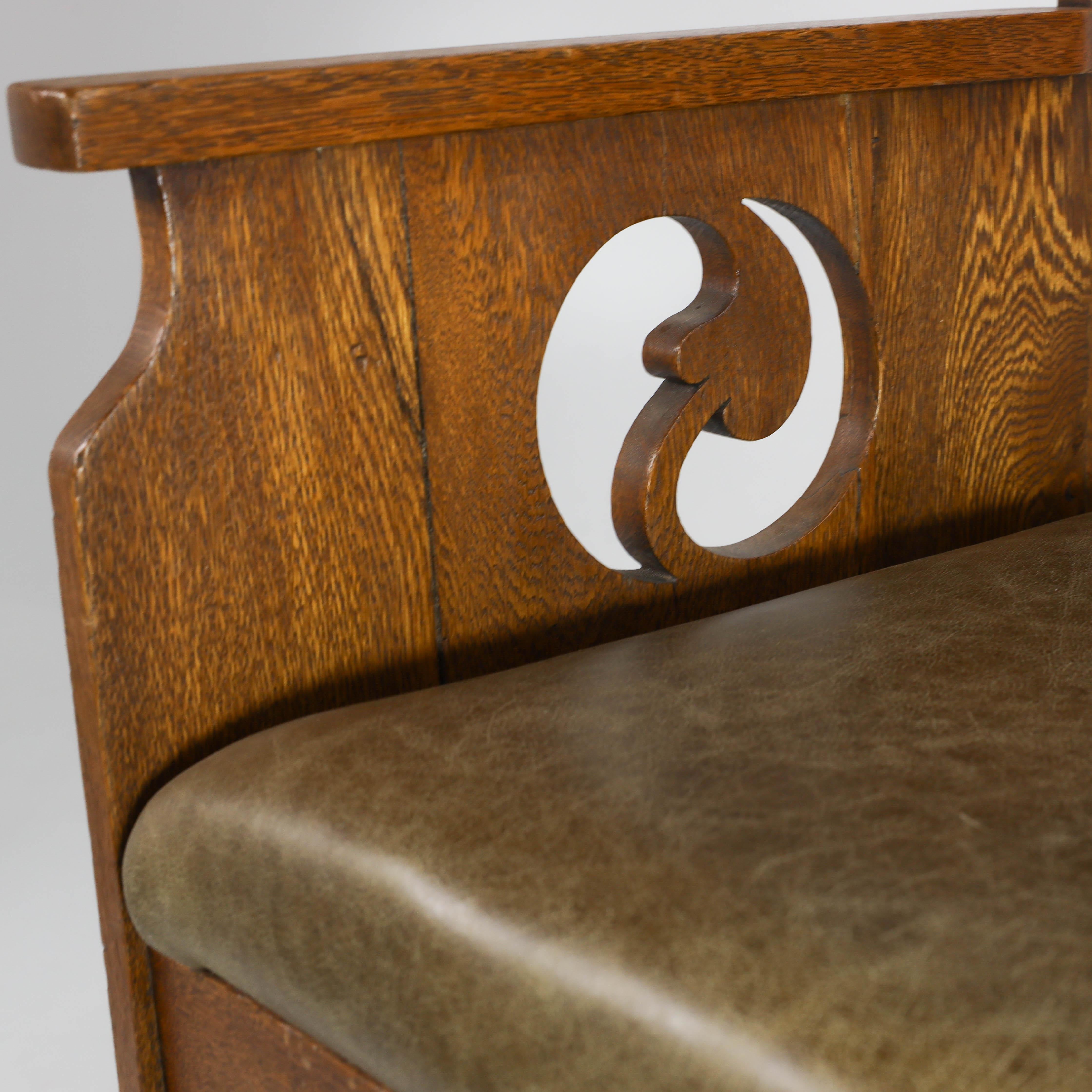 Oak Goodyers of Regent St. An Arts & Crafts oak armchair with stylized decoration For Sale