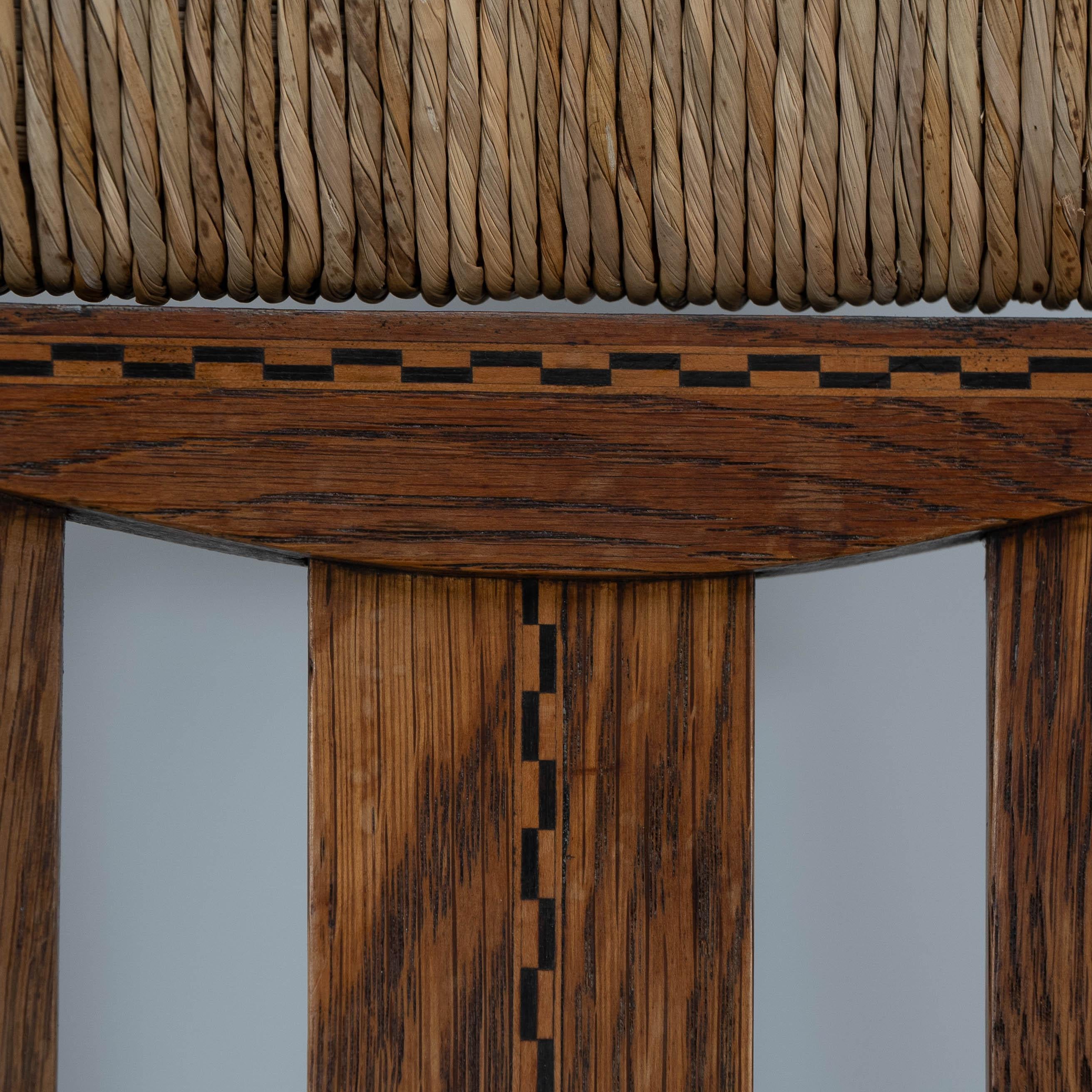 British Goodyers of Regent St. George Walton style. An Arts & Crafts inlaid rush seat For Sale