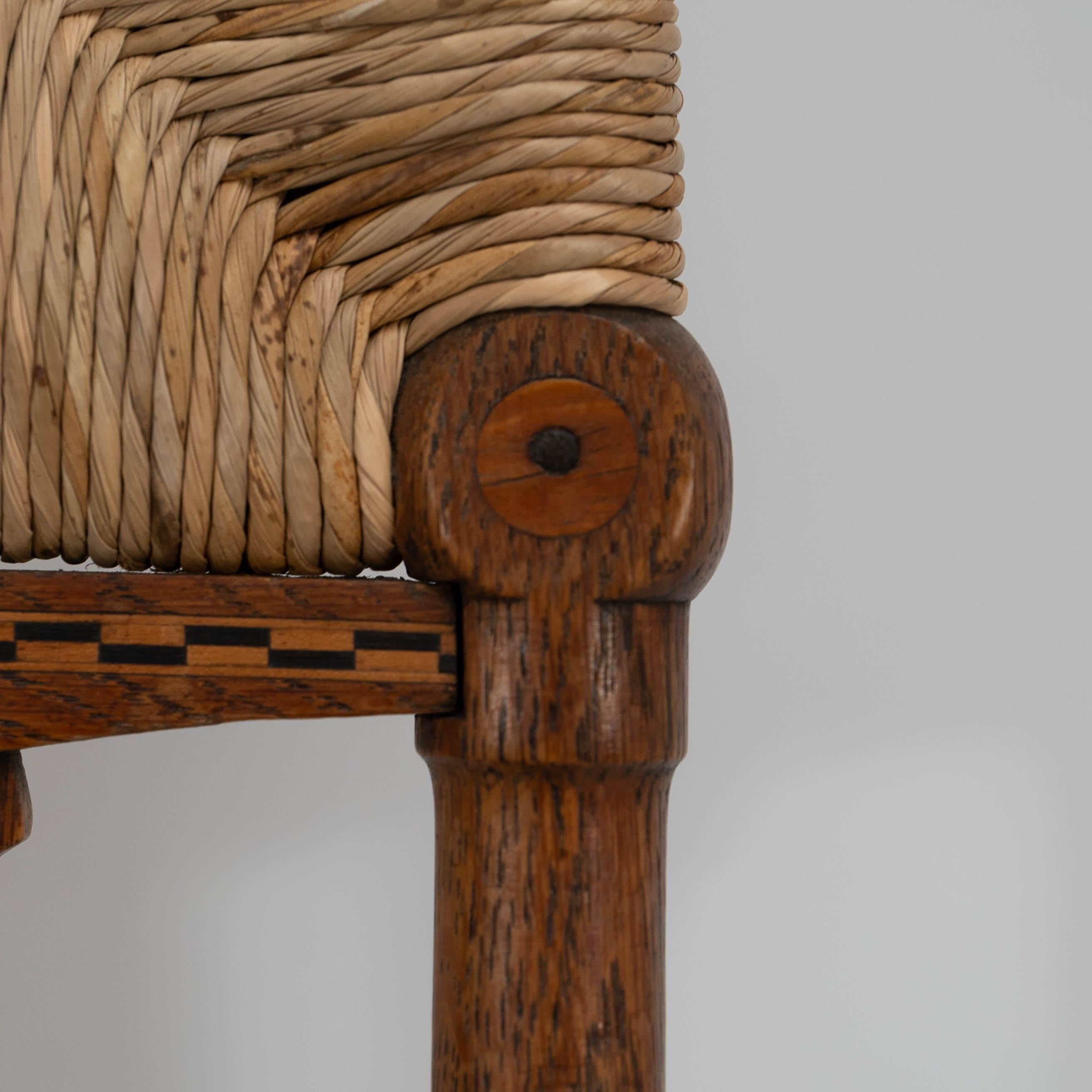 Goodyers of Regent St. George Walton style. An Arts & Crafts inlaid rush seat In Good Condition For Sale In London, GB